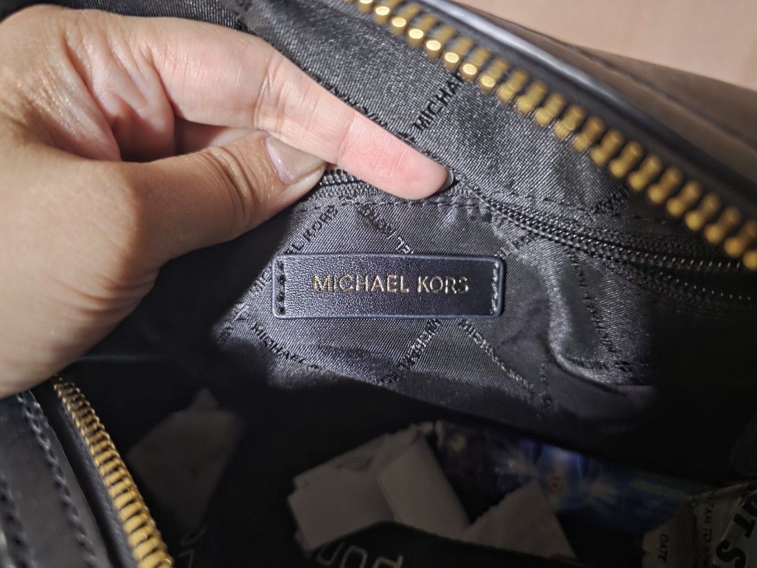 MK medium duffle bag (Category: Luxury Bags & Wallets) located in Carmona. Submitted by ahvee.ph (Listing ID 1419522123, Image 2). Description: - Authentic Michael Kors handbag - Color: Black - Gold-tone logo charm and zipper - Interior: Michael Kors label - Made in Indonesia - Model: AC-2206 F22 35S2GTFU2B.