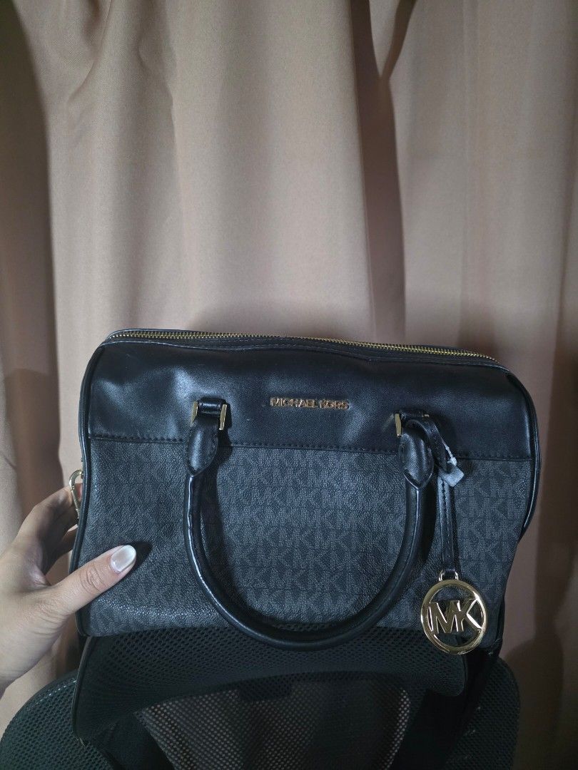 MK medium duffle bag (Category: Luxury Bags & Wallets) located in Carmona. Submitted by ahvee.ph (Listing ID 1419522123, Image 1). Description: - Authentic Michael Kors handbag - Color: Black - Gold-tone logo charm and zipper - Interior: Michael Kors label - Made in Indonesia - Model: AC-2206 F22 35S2GTFU2B.