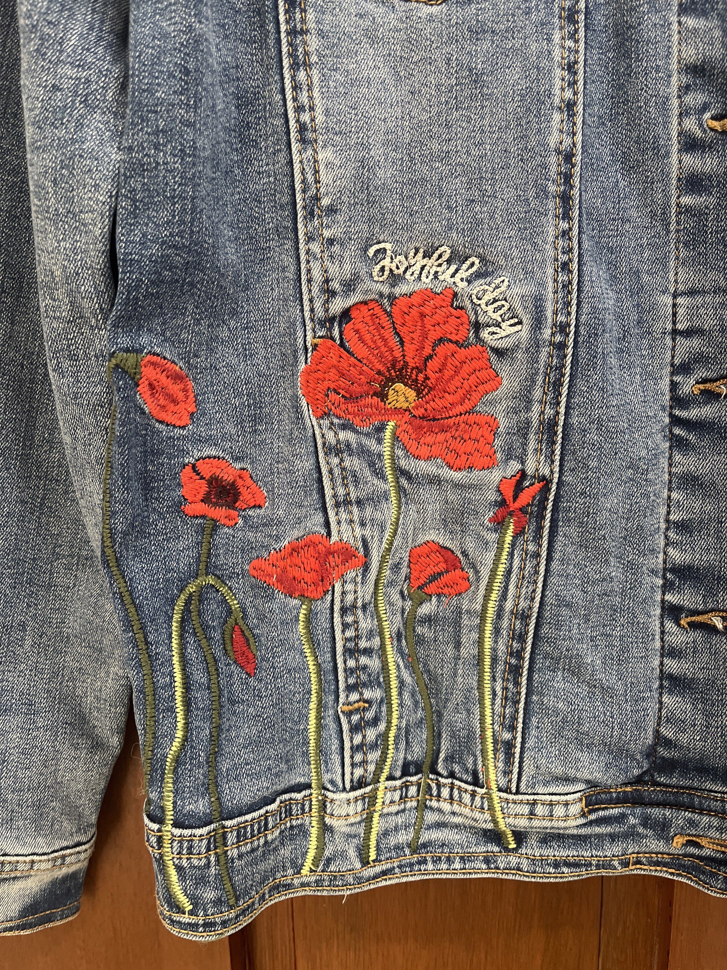 Nanette Lepore Embroidered Denim Jacket (Category: Coats, Jackets and Outerwear) located in Muntinlupa City. Submitted by timttam (Listing ID 1419480174, Image 2). Description: - Nanette Lepore denim jacket - Stunning red poppy embroidery on front, back, and sleeves - Light blue wash - Classic button-up design - buttons may be slightly worn out - Two chest pockets - Relaxed fit.