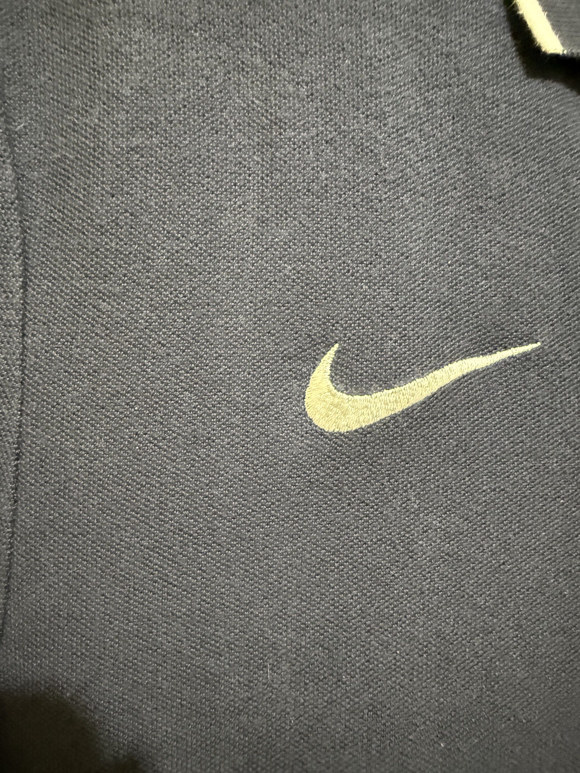 Nike Polo Shirt Navy Blue (Category: Tshirts & Polo Shirts ) located in Los Banos. Submitted by elbideclutter (Listing ID 1419500096, Image 3). Description: Navy blue Nike polo shirt with white trim on the collar and sleeves. Features the Nike logo on the left chest. It has a three-button placket and short sleeves. Relax Fit M See sample fit above.