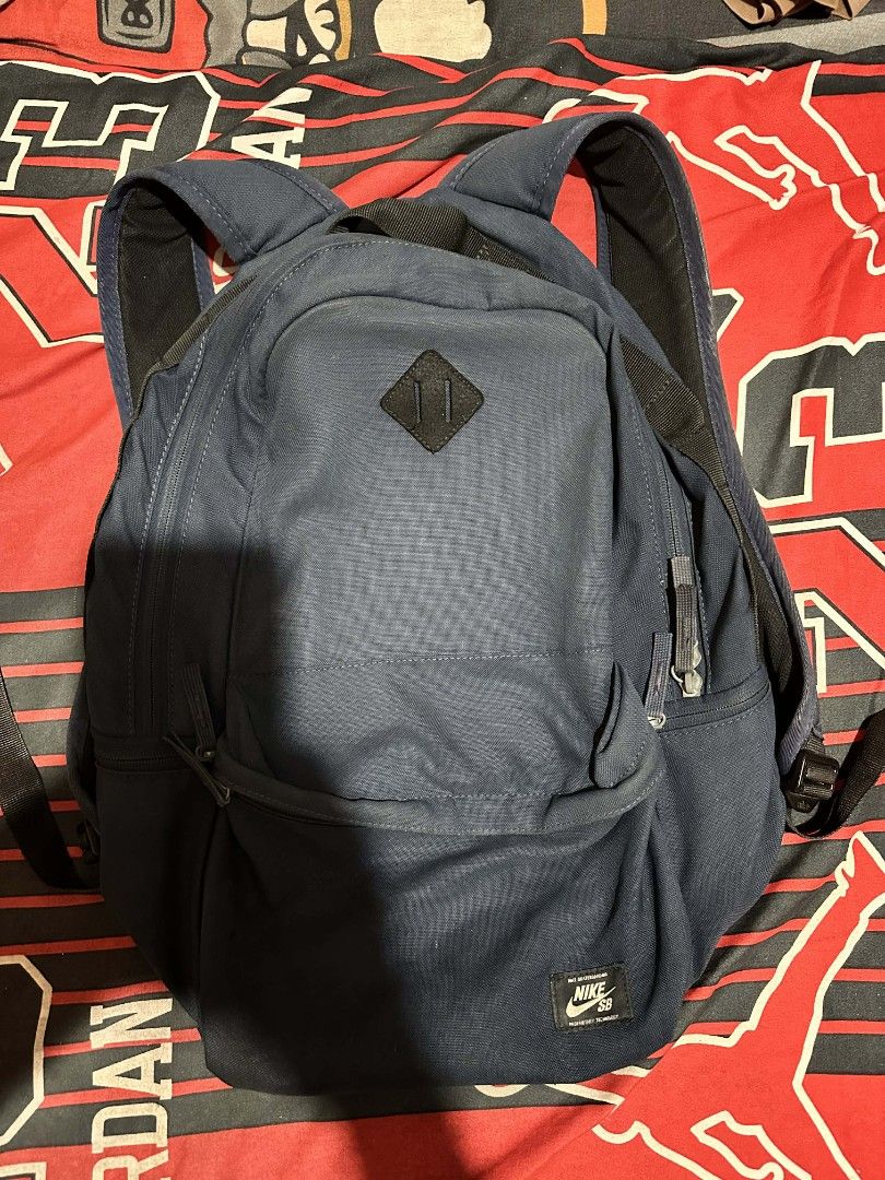 Nike SB Backpack (Category: Backpacks) located in Isabel. Submitted by mb0625meshach (Listing ID 1419505213, Image 1). Description: - Nike SB backpack - Color: Navy blue - Durable construction - Padded shoulder straps for comfort - Convenient front pocket - Top handle for easy carrying - Features the Nike SB logo patch - Secure zipper closure Like new condition sign of usage only Leyte loc Shipping Via J&T.