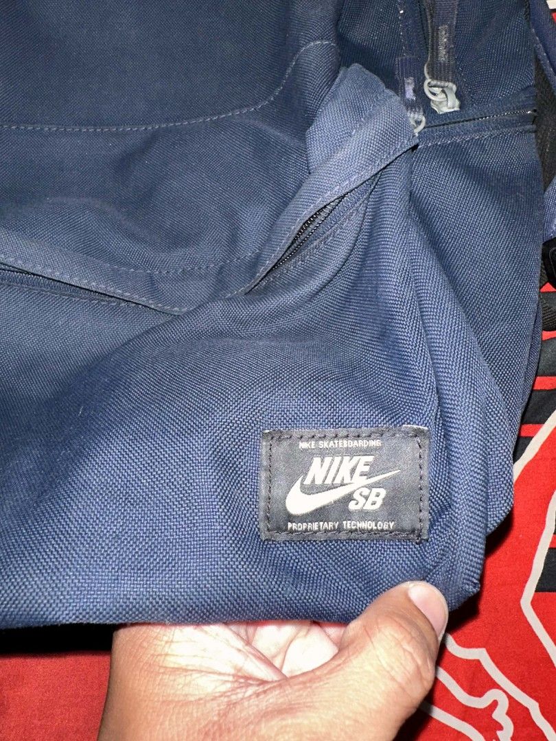 Nike SB Backpack (Category: Backpacks) located in Isabel. Submitted by mb0625meshach (Listing ID 1419505213, Image 2). Description: - Nike SB backpack - Color: Navy blue - Durable construction - Padded shoulder straps for comfort - Convenient front pocket - Top handle for easy carrying - Features the Nike SB logo patch - Secure zipper closure Like new condition sign of usage only Leyte loc Shipping Via J&T.