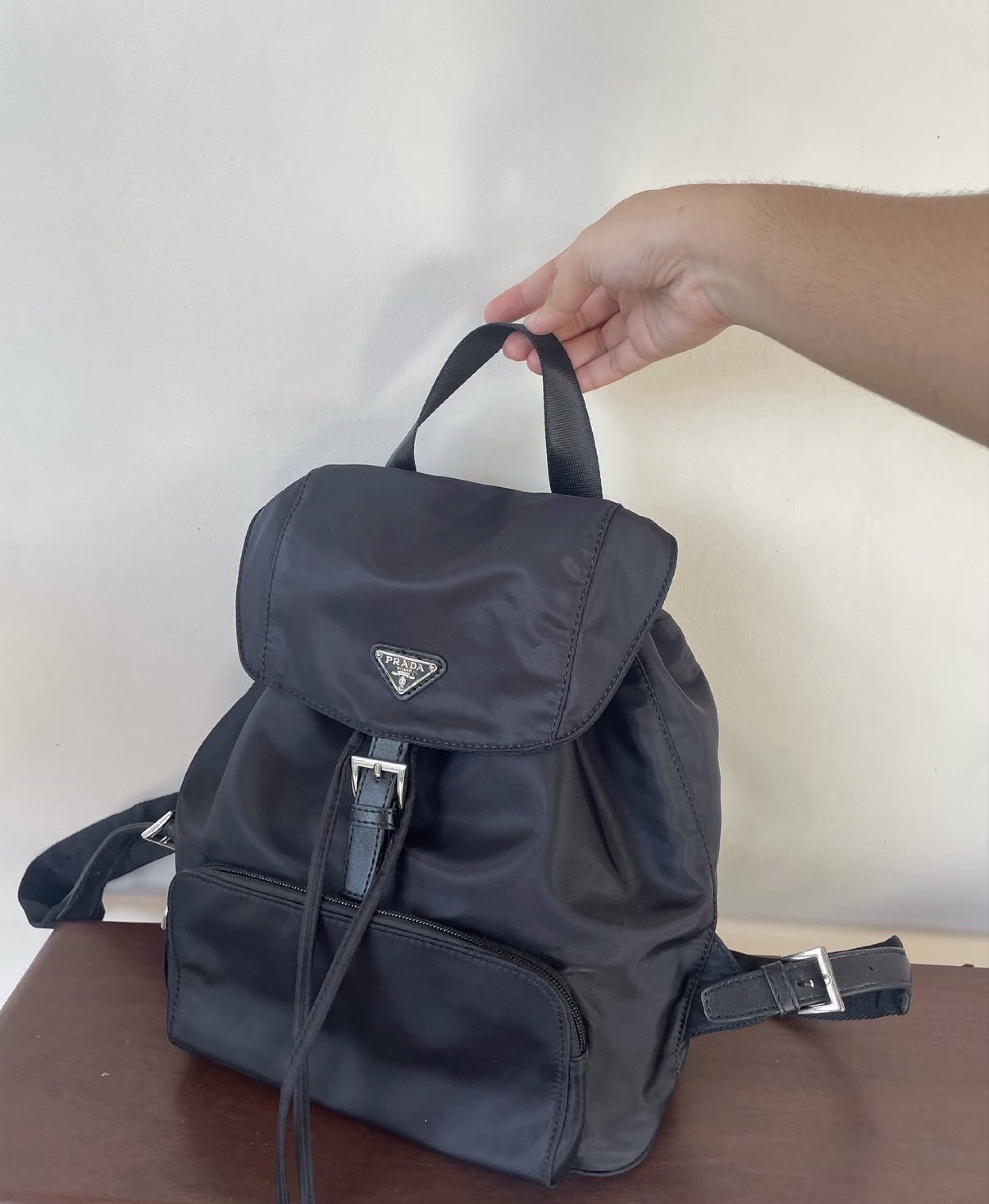 Prada Nylon Backpack (Category: Luxury Bags & Wallets) located in Davao. Submitted by mystore07 (Listing ID 1419418303, Image 1). Description: Prada Nylon Backpack (excellent condition) Korea sourced No flaw Excellent nylon condition Engraved zip! With code NGA 3800 See photos for details No photo grabbing please! 24 hours reservation. Strictly no cancellations .