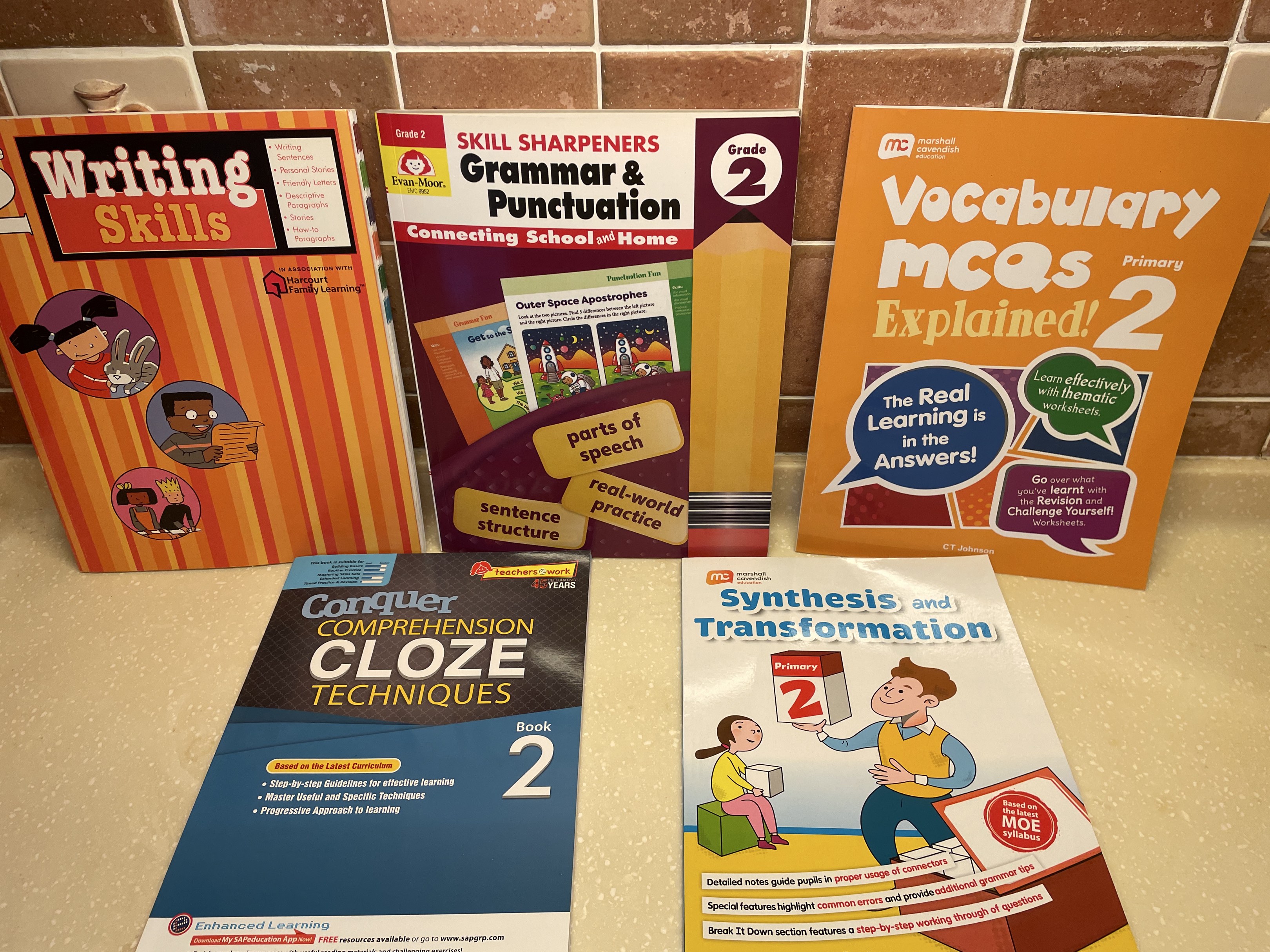 Primary 2 English assessment workbooks.