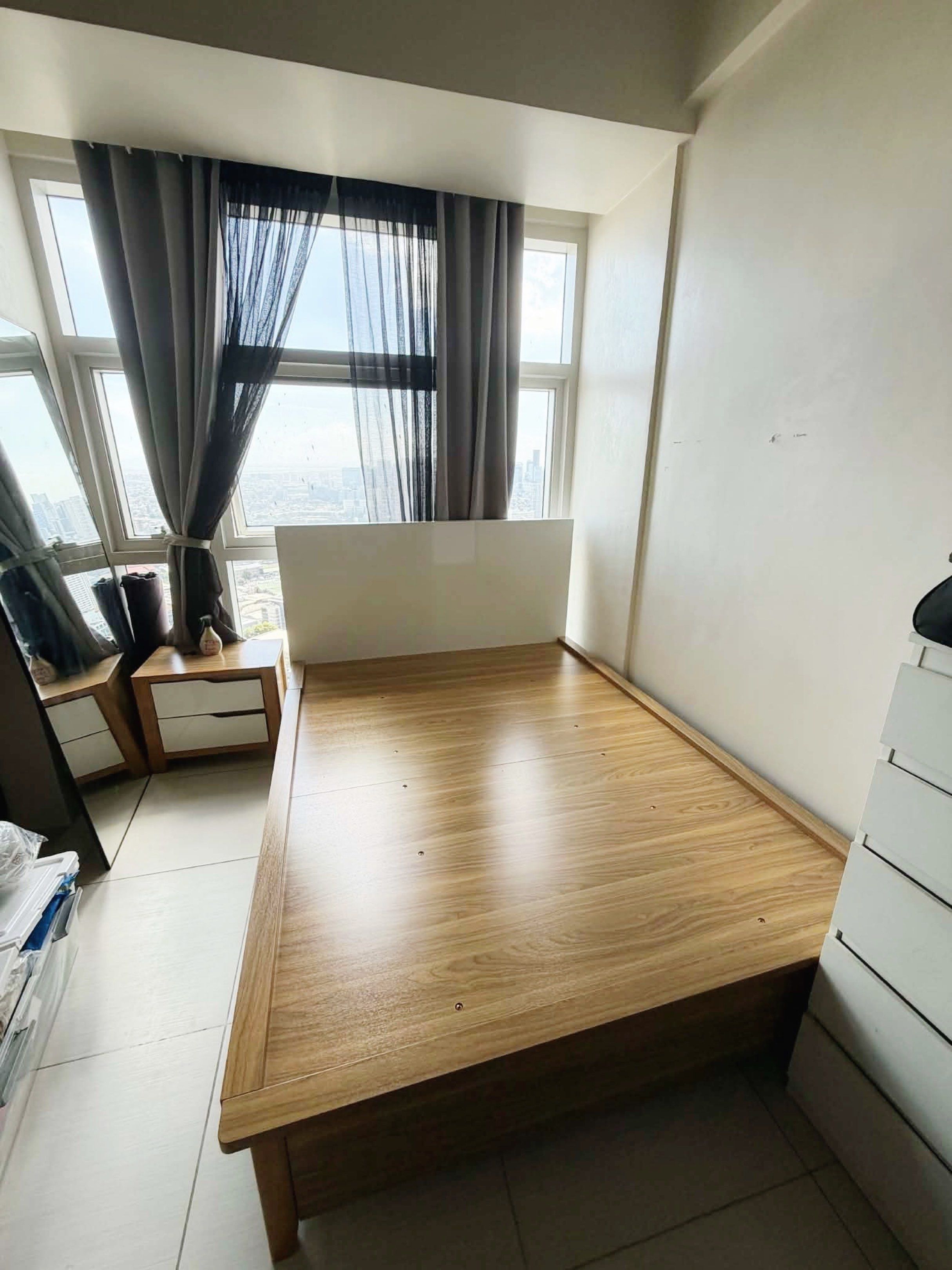 Wooden Queen Size Storage Bed Frame with Headboard (Category: Bed Frames & Mattresses) located in Manila. Submitted by closetbymia (Listing ID 1419472528, Image 3). Description: - Queen-size bed frame: 59W x 78L x 16 H - White headboard: 45H x 59 L - Wooden finish - Integrated storage compartment - Wooden base and legs - Includes Uratex mattress: 60 x 75 inches - Modern design -No Issue! Super good condition! Even the mattress very good condition