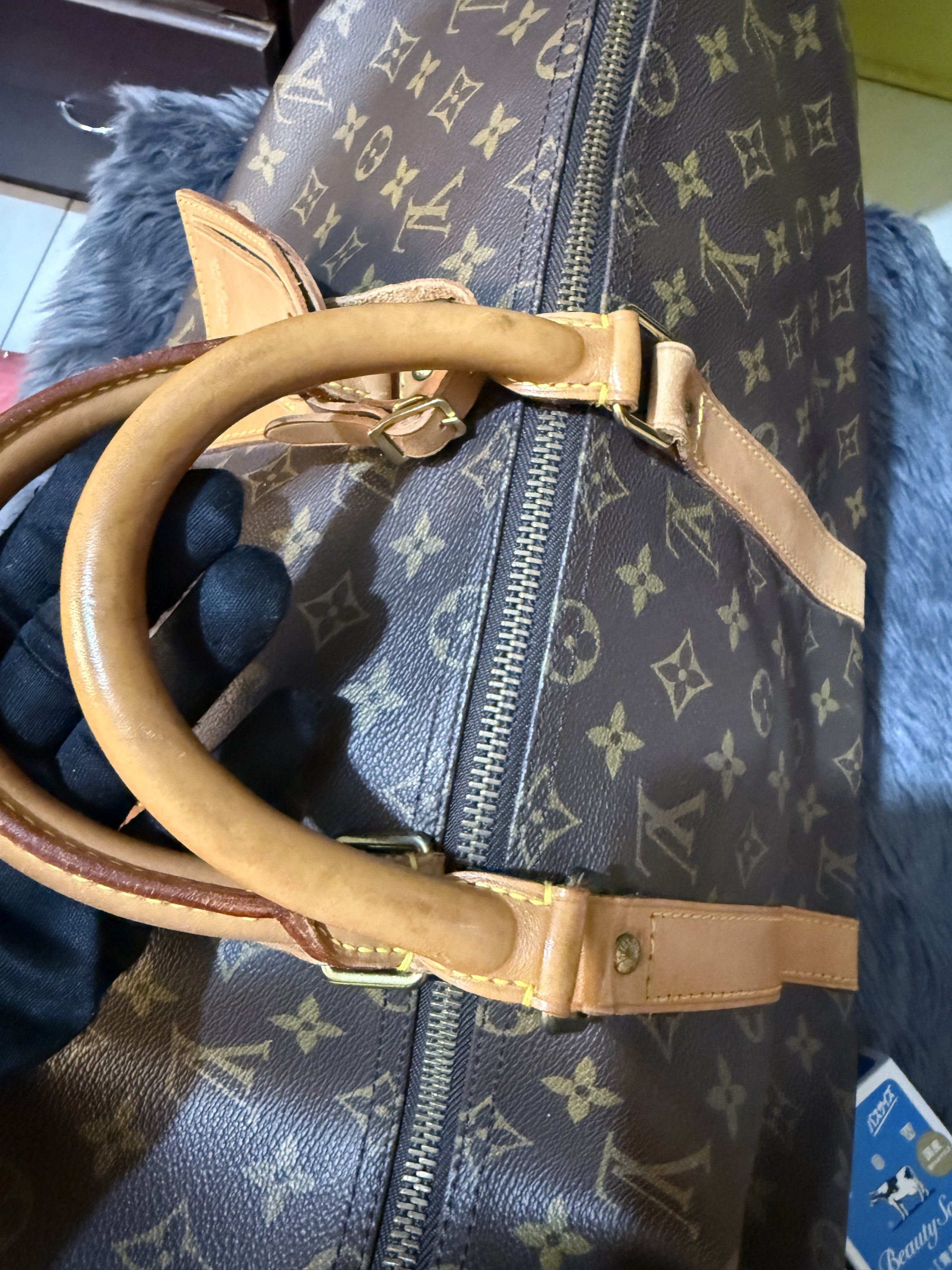 Sale‼️ Preloved LV Keepall 50cm (Category: Luxury Bags & Wallets) located in Cavite. Submitted by nigella02 (Listing ID 1414990961, Image 3). Description: Preloved Original Keepall 50cm Rank A Condition Honey patina, shows signs of usage at a minimum Guaranteed Original. Bought in Japan. All corners in tact. Handwriting in the inner lining. Ideal For travel. .