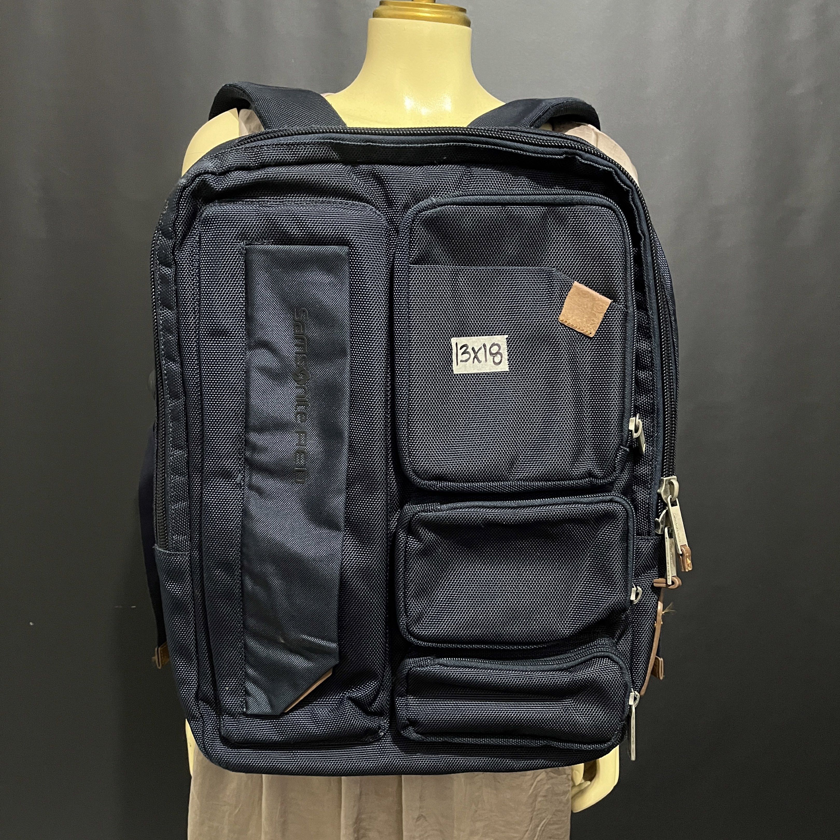 Samsonite RED Backpack (Category: Backpacks) located in Cabadbaran. Submitted by dfgthriftology (Listing ID 1419526020, Image 1). Description: - Samsonite RED backpack - Dark blue exterior with brown leather accents - Multiple compartments for organized storage - Dedicated laptop compartment - Padded back panel for comfort - Adjustable shoulder straps - Interior branded with Samsonite RED logo.
