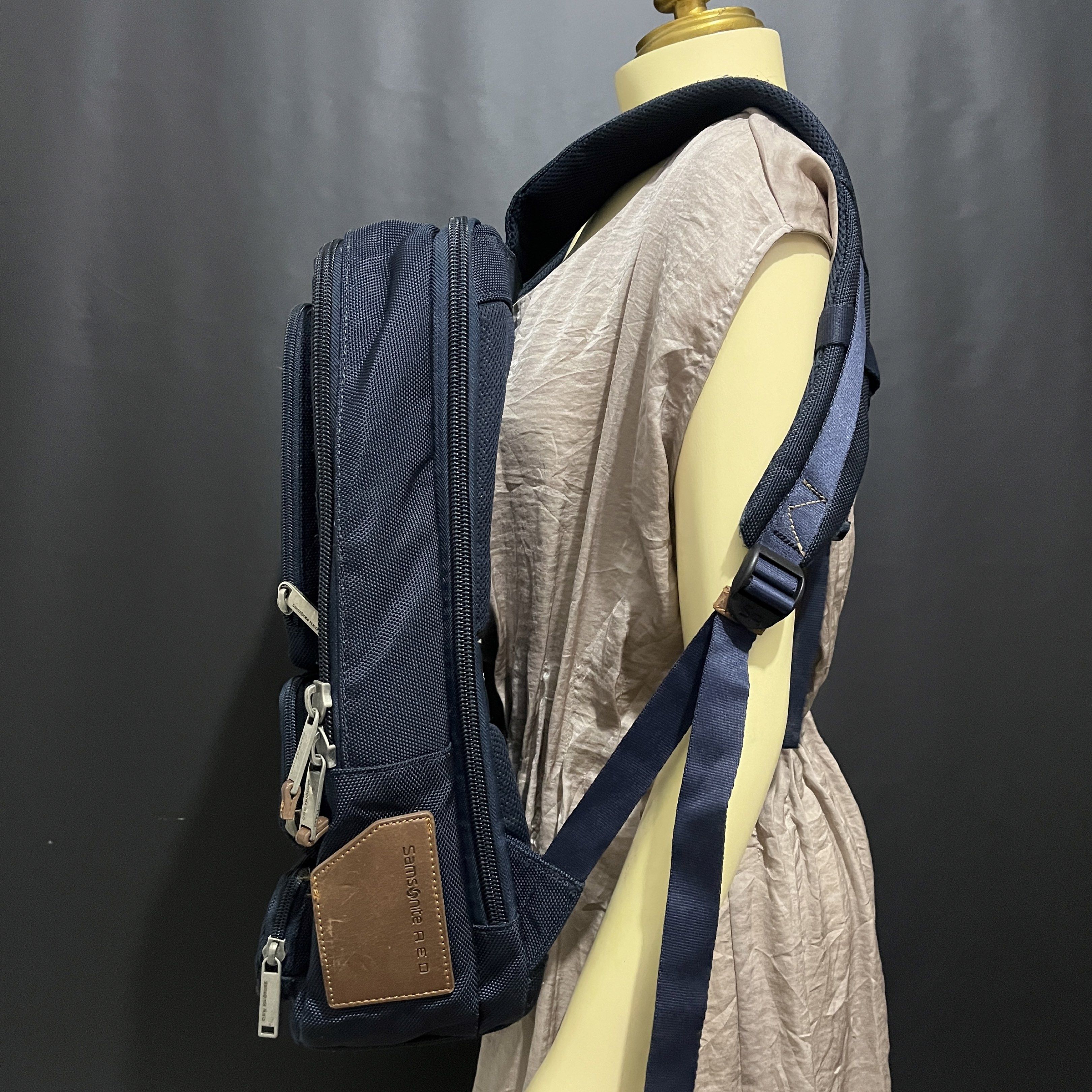 Samsonite RED Backpack (Category: Backpacks) located in Cabadbaran. Submitted by dfgthriftology (Listing ID 1419526020, Image 3). Description: - Samsonite RED backpack - Dark blue exterior with brown leather accents - Multiple compartments for organized storage - Dedicated laptop compartment - Padded back panel for comfort - Adjustable shoulder straps - Interior branded with Samsonite RED logo.