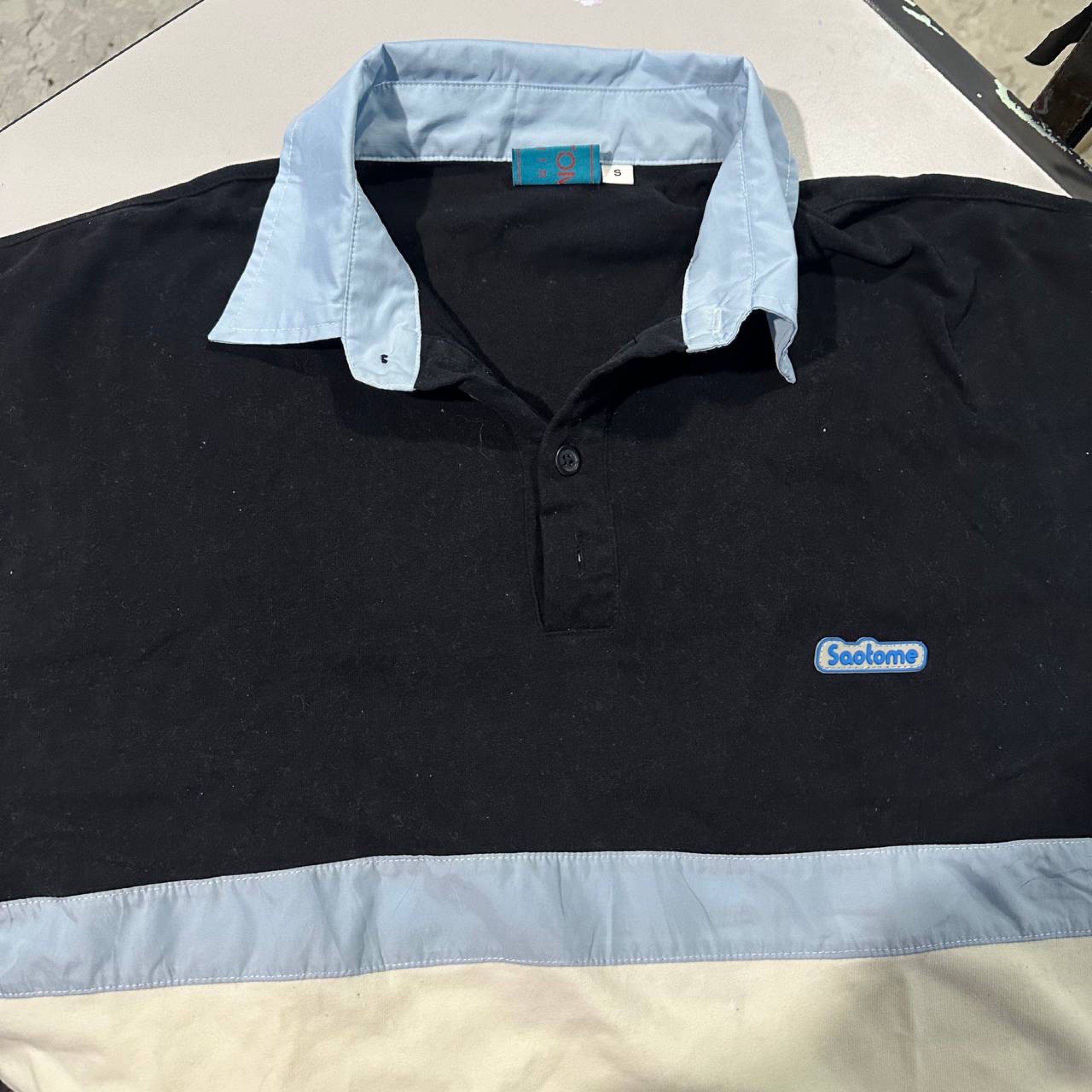 Saotome Polo Shirt - Size S (Category: Tshirts & Polo Shirts ) located in Manila. Submitted by 143aly (Listing ID 1419396137, Image 1). Description: - Saotome polo shirt - Color: Black body with light blue collar and accents - Size: Small but can fit to medium to large - Design: Button-down - Features: Small Saotome logo on chest.