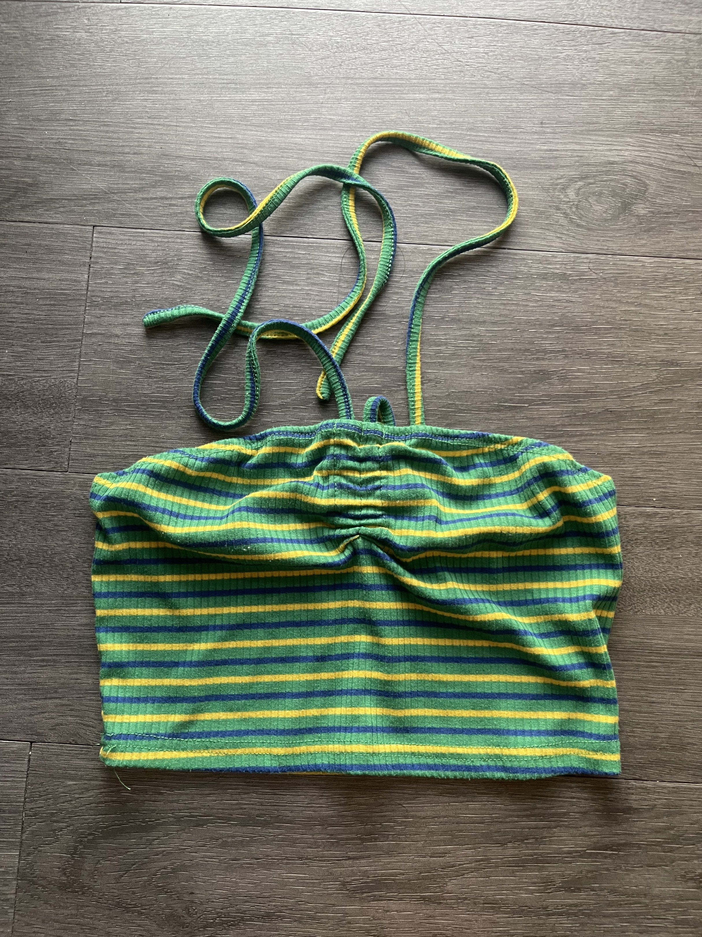 Shein Striped Tube Top (Category: Sleeveless) located in Taguig. Submitted by xxtheresse (Listing ID 1419555096, Image 1). Description: - Shein tube top - Size: XS - Color: Green, yellow, and blue striped - Design: Ruched front, tie straps - Material: Ribbed fabric - Perfect for warm weather - Stylish and comfortable.