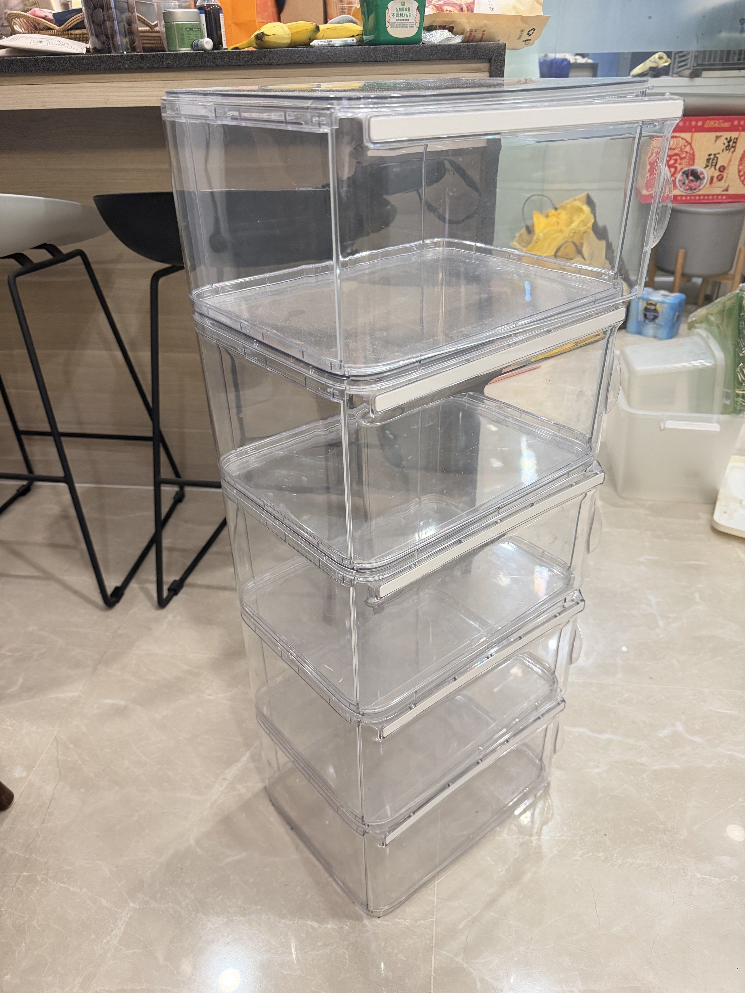 Stackable Clear Plastic Storage Containers (Category: Storage Boxes & Baskets) located in Singapore. Submitted by splendidstarxh (Listing ID 1419508929, Image 2). Description: Set of stackable clear plastic storage containers. Great for organizing your pantry, fridge, or any space. The containers are in excellent condition, with minimal signs of use. They are easy to clean and provide a clear view of the contents..