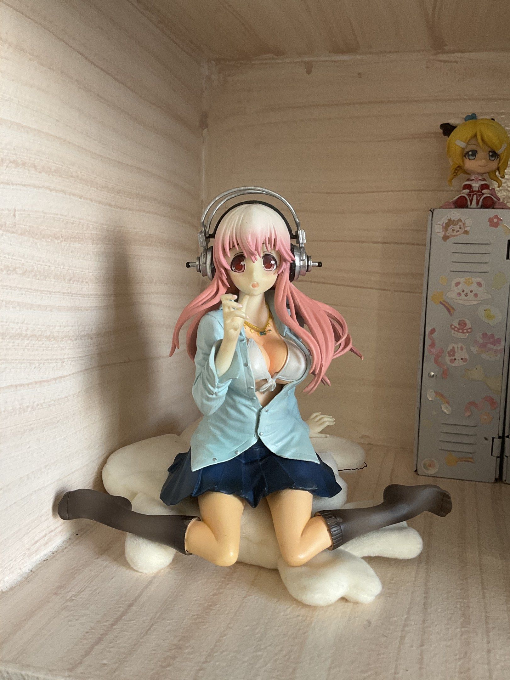 Super Sonico Figure FOR TRADE ONLY!! (Category: Figurines & Statues) located in Caloocan City. Submitted by yuxeiru (Listing ID 1419478255, Image 1). Description: - Sonico figure - Pink hair and headphones - Light blue jacket and dark blue skirt - Sitting on a white cloud cushion - Displayed in a case with other miniatures.