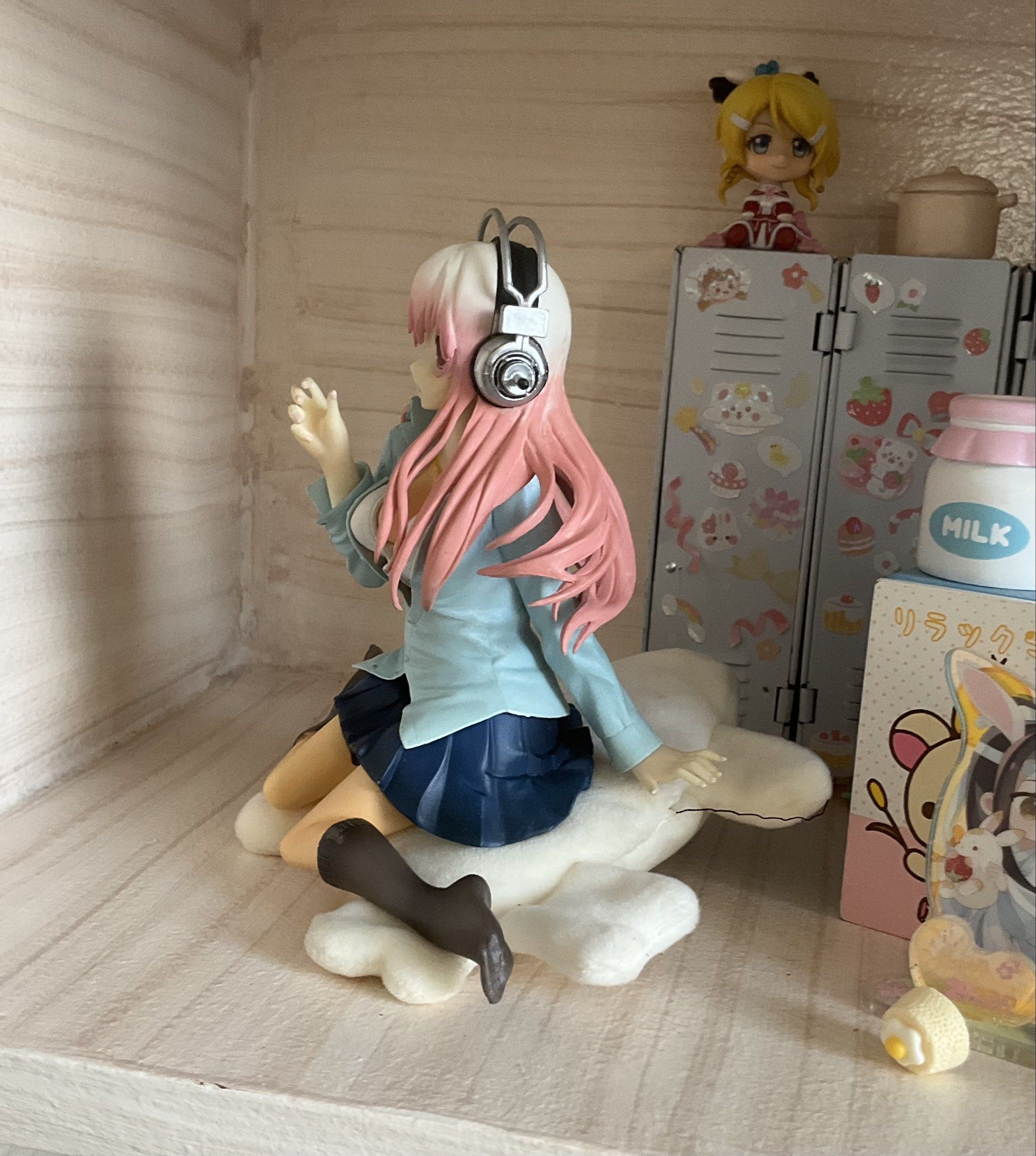 Super Sonico Figure FOR TRADE ONLY!! (Category: Figurines & Statues) located in Caloocan City. Submitted by yuxeiru (Listing ID 1419478255, Image 2). Description: - Sonico figure - Pink hair and headphones - Light blue jacket and dark blue skirt - Sitting on a white cloud cushion - Displayed in a case with other miniatures.