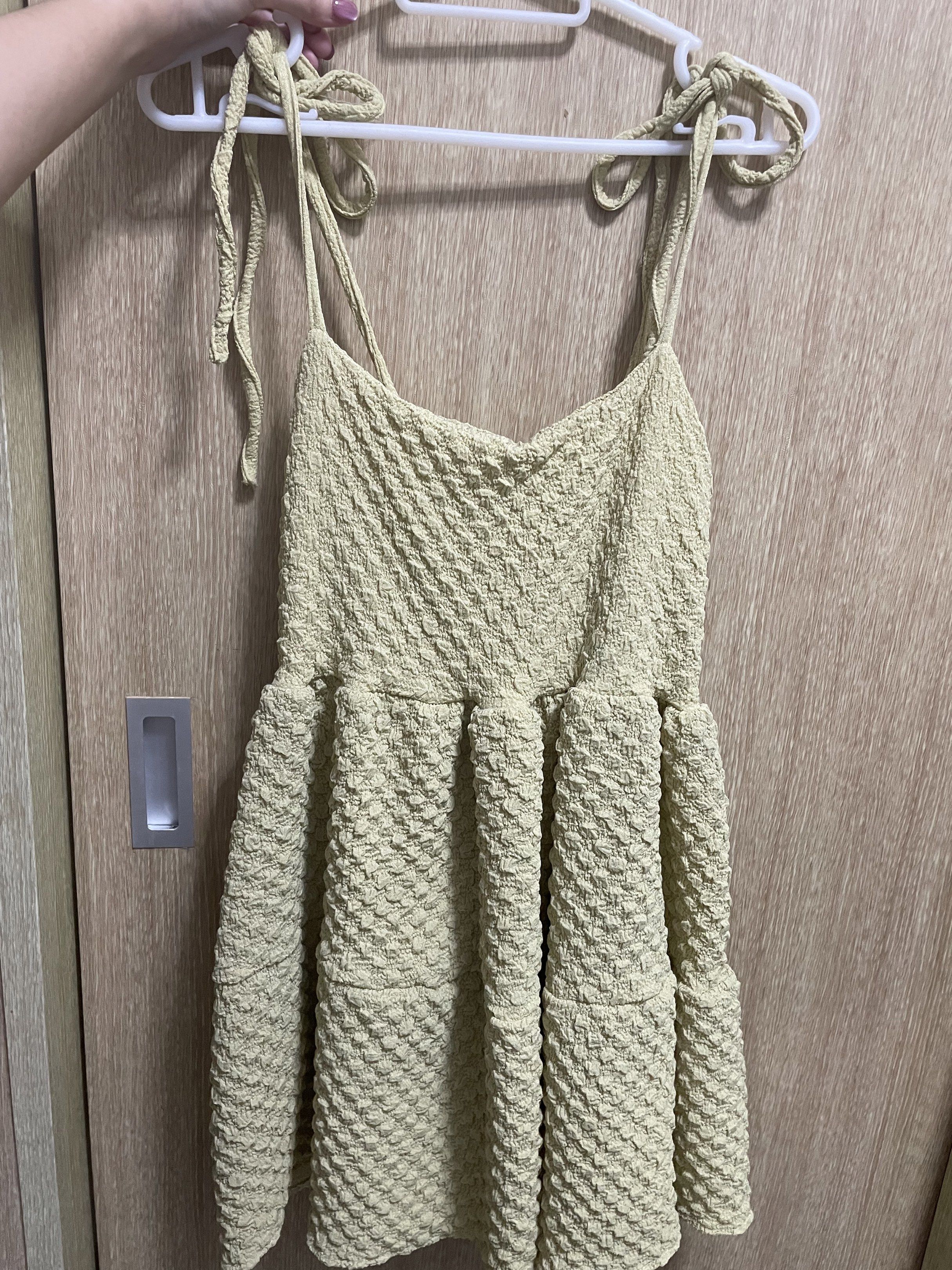 Textured Tie-Strap Dress (Category: Dresses) located in Quezon City. Submitted by mclbee (Listing ID 1419507375, Image 1). Description: - Textured fabric - Tie-strap design - Fitted bodice - Flared skirt - Adjustable straps - Casual and stylish.