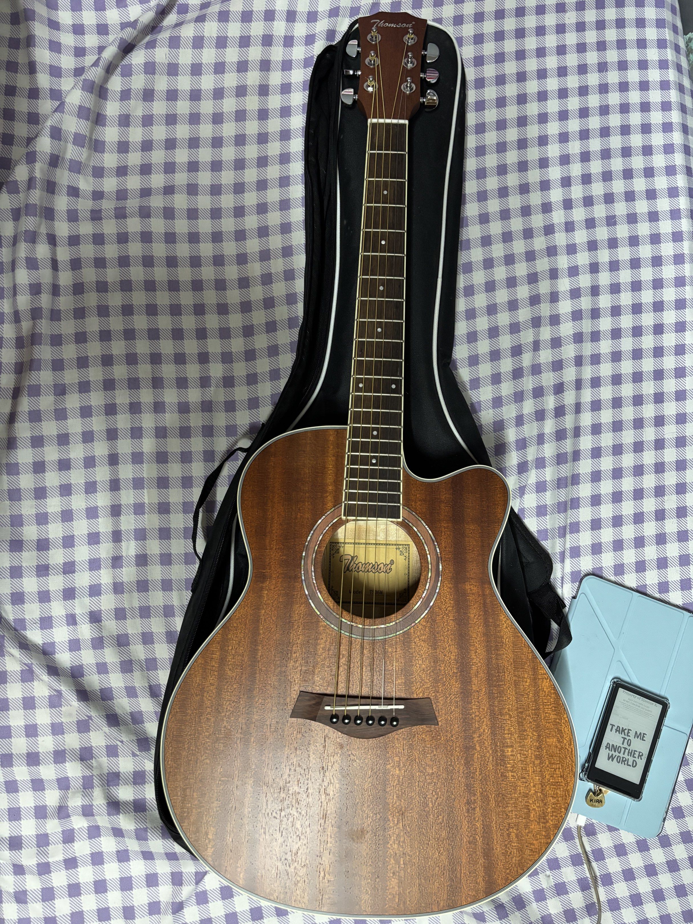 Thomson Baby Guitar TS36M (Category: Musical Instruments) located in Antipolo. Submitted by wildrabbit0328b2 (Listing ID 1419554589, Image 1). Description: Thomson Baby Guitar TS36M 36inches with truss rod die cast tuning pegs mahogany wood Slide up to the last pic for the included freebies RFS bought it impulsively nung December 2025. realized i don't have time to learn it dahil busy sa work..