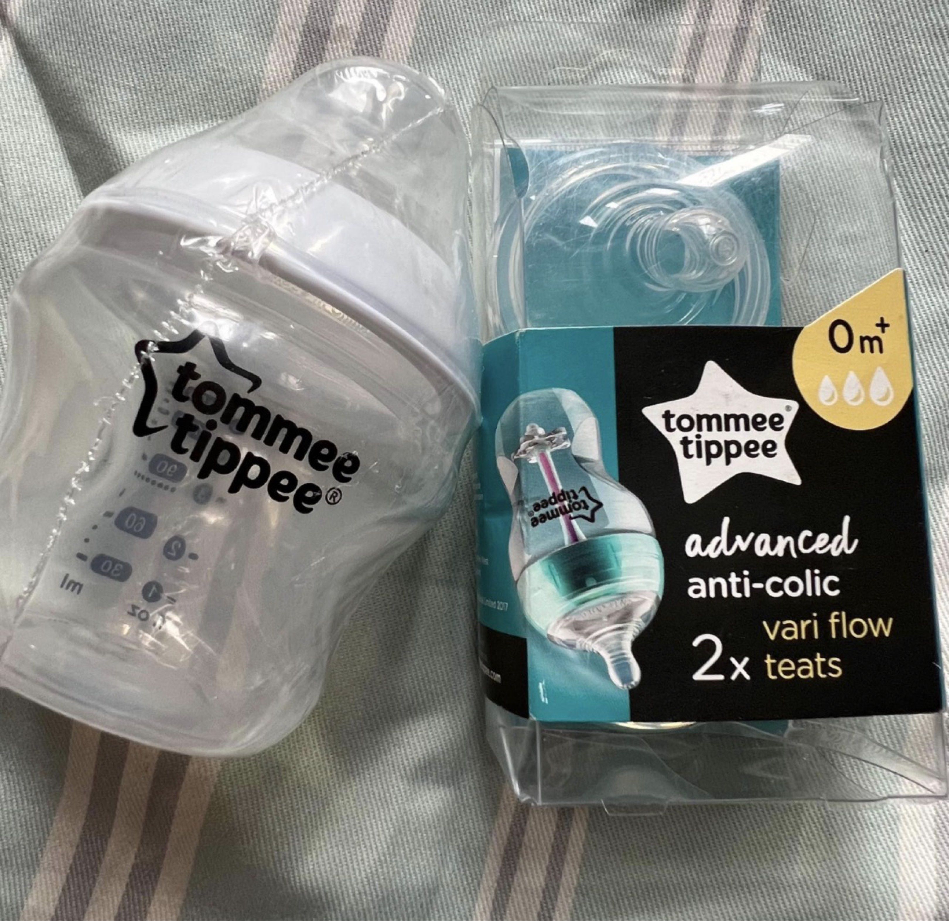Tommee Tippee Advanced Anti-Colic Baby Bottle (Category: Breastfeeding & Bottle Feeding) located in Quezon City. Submitted by aduyah (Listing ID 1419587167, Image 1). Description: Listing includes a Tommee Tippee Advanced Anti-Colic baby bottle and two vari flow teats. The bottle has measurements up to 150ml/5 fl oz. The teats are suitable for 0+ months. The packaging indicates the teats are designed for use with Tommee Tippee anti-colic bottles 