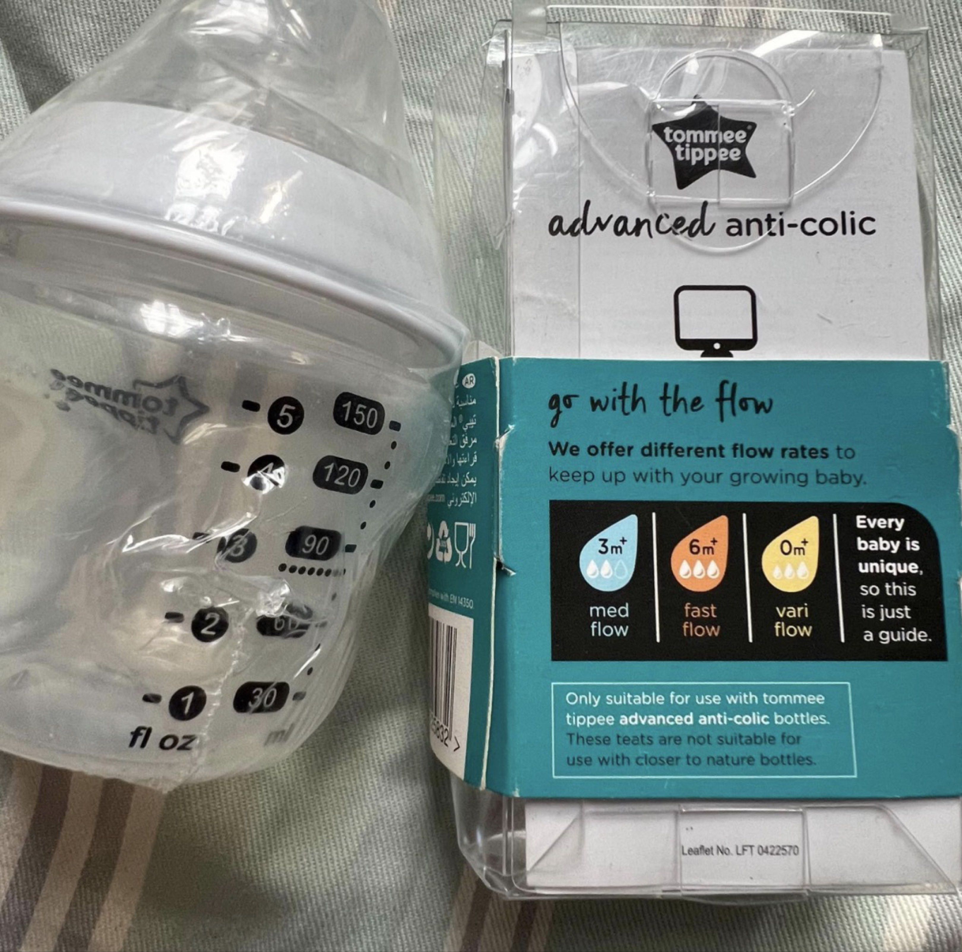Tommee Tippee Advanced Anti-Colic Baby Bottle (Category: Breastfeeding & Bottle Feeding) located in Quezon City. Submitted by aduyah (Listing ID 1419587167, Image 2). Description: Listing includes a Tommee Tippee Advanced Anti-Colic baby bottle and two vari flow teats. The bottle has measurements up to 150ml/5 fl oz. The teats are suitable for 0+ months. The packaging indicates the teats are designed for use with Tommee Tippee anti-colic bottles 