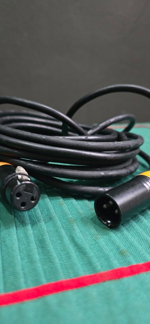XLR Microphone Cable (Working) Decluterring my stuffz (Category: Microphones) located in Pasig City. Submitted by da_stone (Listing ID 1419491777, Image 2). Description: - Black XLR microphone cable - Features orange accents on connectors - Coiled design - Ready for use with your audio equipment 5 meters i guess .