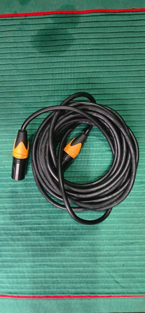 XLR Microphone Cable (Working) Decluterring my stuffz (Category: Microphones) located in Pasig City. Submitted by da_stone (Listing ID 1419491777, Image 1). Description: - Black XLR microphone cable - Features orange accents on connectors - Coiled design - Ready for use with your audio equipment 5 meters i guess .