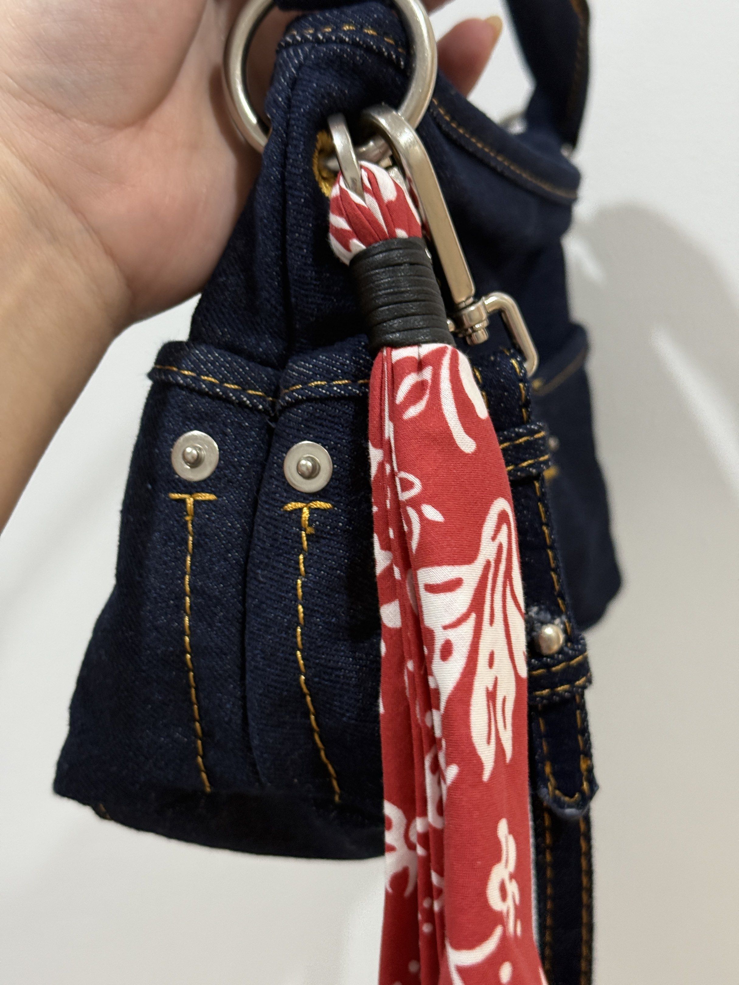 Zara Denim Handbag with Scarf (Category: Shoulder Bags) located in Pasig City. Submitted by abbyrds (Listing ID 1419461837, Image 2). Description: - Unused Zara denim handbag - Dark blue denim exterior - Detachable red scarf included - Top handle and detachable shoulder strap - Zipper closure - Features a small front pocket - Includes original price tag.