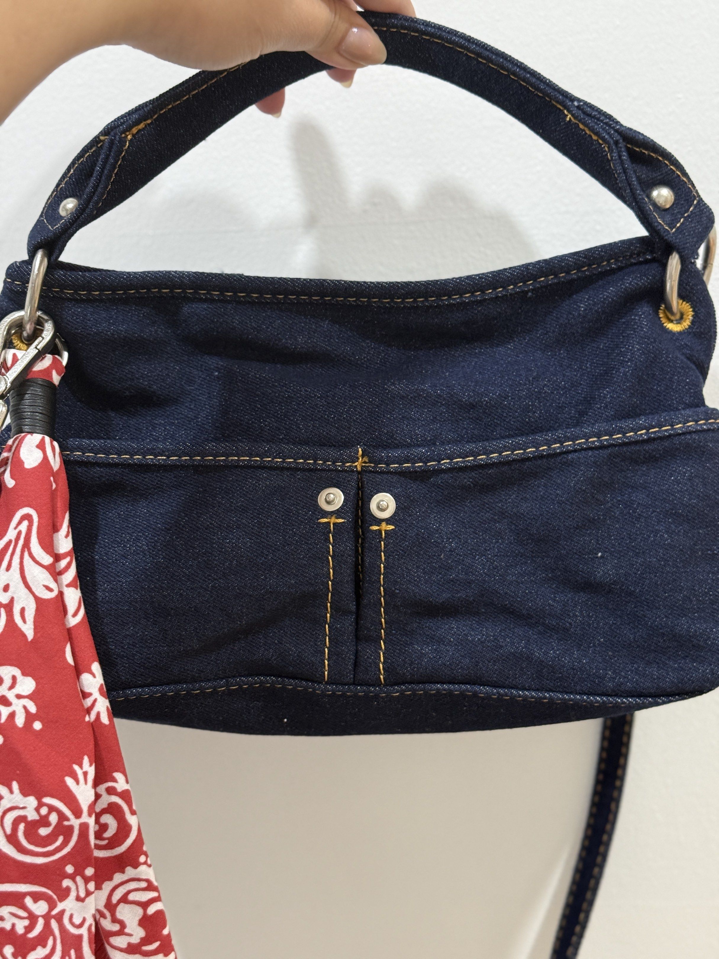 Zara Denim Handbag with Scarf (Category: Shoulder Bags) located in Pasig City. Submitted by abbyrds (Listing ID 1419461837, Image 1). Description: - Unused Zara denim handbag - Dark blue denim exterior - Detachable red scarf included - Top handle and detachable shoulder strap - Zipper closure - Features a small front pocket - Includes original price tag.