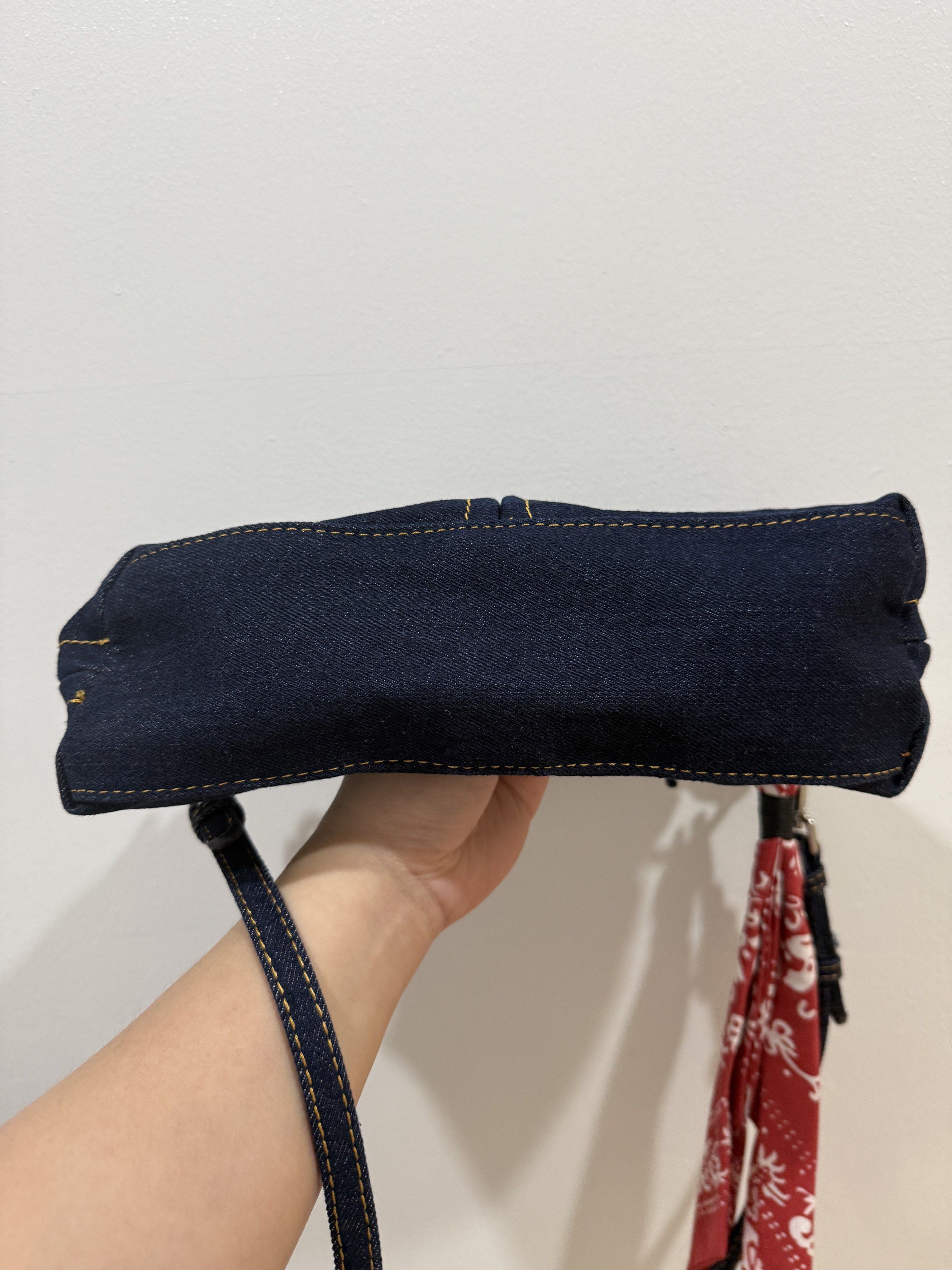 Zara Denim Handbag with Scarf (Category: Shoulder Bags) located in Pasig City. Submitted by abbyrds (Listing ID 1419461837, Image 3). Description: - Unused Zara denim handbag - Dark blue denim exterior - Detachable red scarf included - Top handle and detachable shoulder strap - Zipper closure - Features a small front pocket - Includes original price tag.