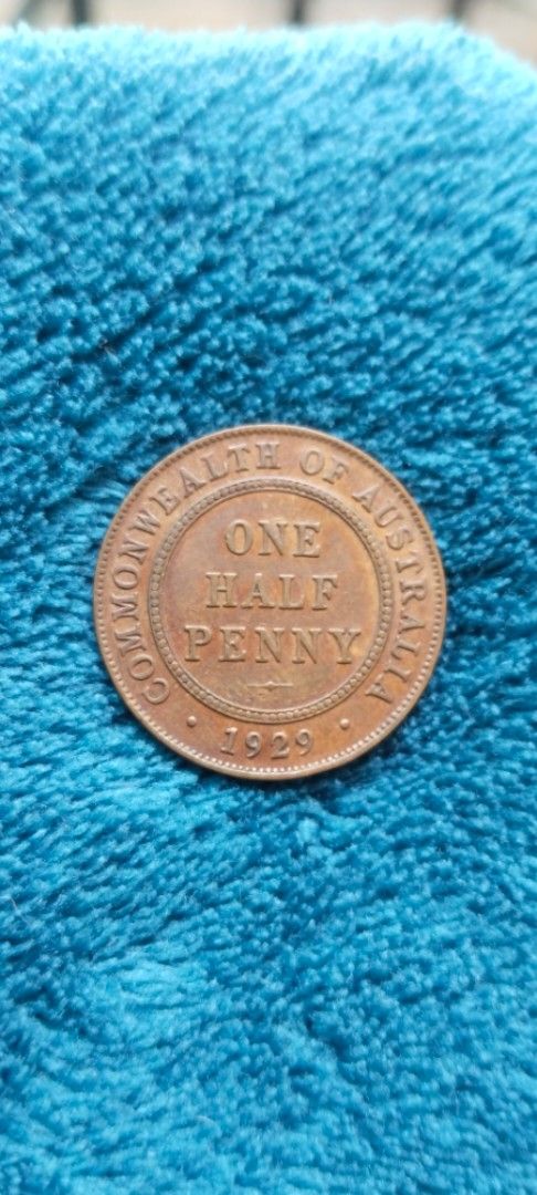 1929 Australian One Half Penny Coin (Category: Currency) located in Manila. Submitted by danlei_coin_collectible (Listing ID 1419632334, Image 2). Description: - 1929 Australian One Half Penny coin - Features King George V on the obverse - Reverse: "ONE HALF PENNY" and "COMMONWEALTH OF AUSTRALIA" - Made of copper - Collectible item.