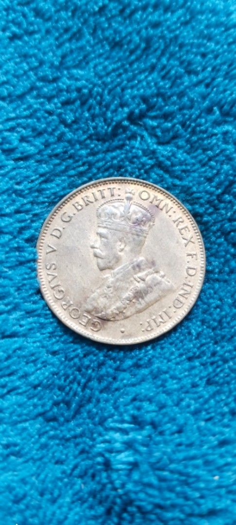 1933 Australian Half Penny Coin (Category: Currency) located in Manila. Submitted by danlei_coin_collectible (Listing ID 1419631577, Image 1). Description: - 1933 Australian Half Penny coin - Features King George V on the obverse - Reverse side: "ONE HALF PENNY" and "1933" - Made of bronze - Circular shape.