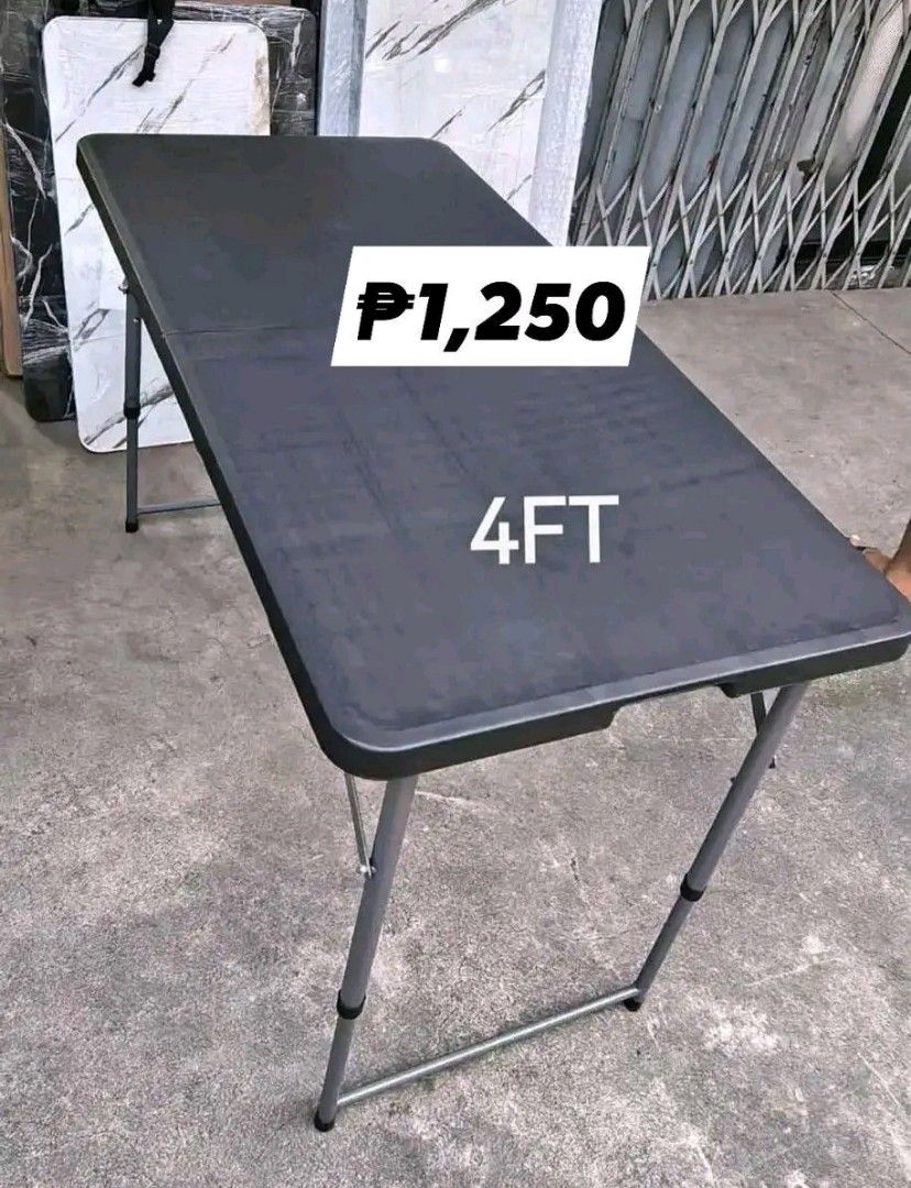4ft Folding Table (Category: Tables & Sets) located in Manila. Submitted by bongsy999mall (Listing ID 1419686599, Image 1). Description: - 4ft Black Folding Table - Price: ₱1,250 - Features foldable legs for easy storage - Sturdy construction - Ideal for events and home use - Practical and space-saving.