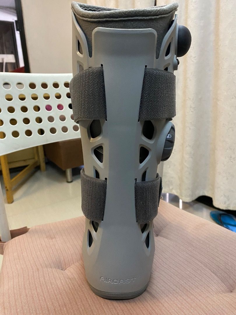 Aircast Walking Boot (X-small) (Category: Braces, Support & Protection) located in Manila. Submitted by jen022882 (Listing ID 1419634764, Image 2). Description: Aircast walking boot. Features adjustable straps for a secure fit. Includes an inflation mechanism for customized support. The sole has a non-slip design. The boot is gray with blue accents on the sole..