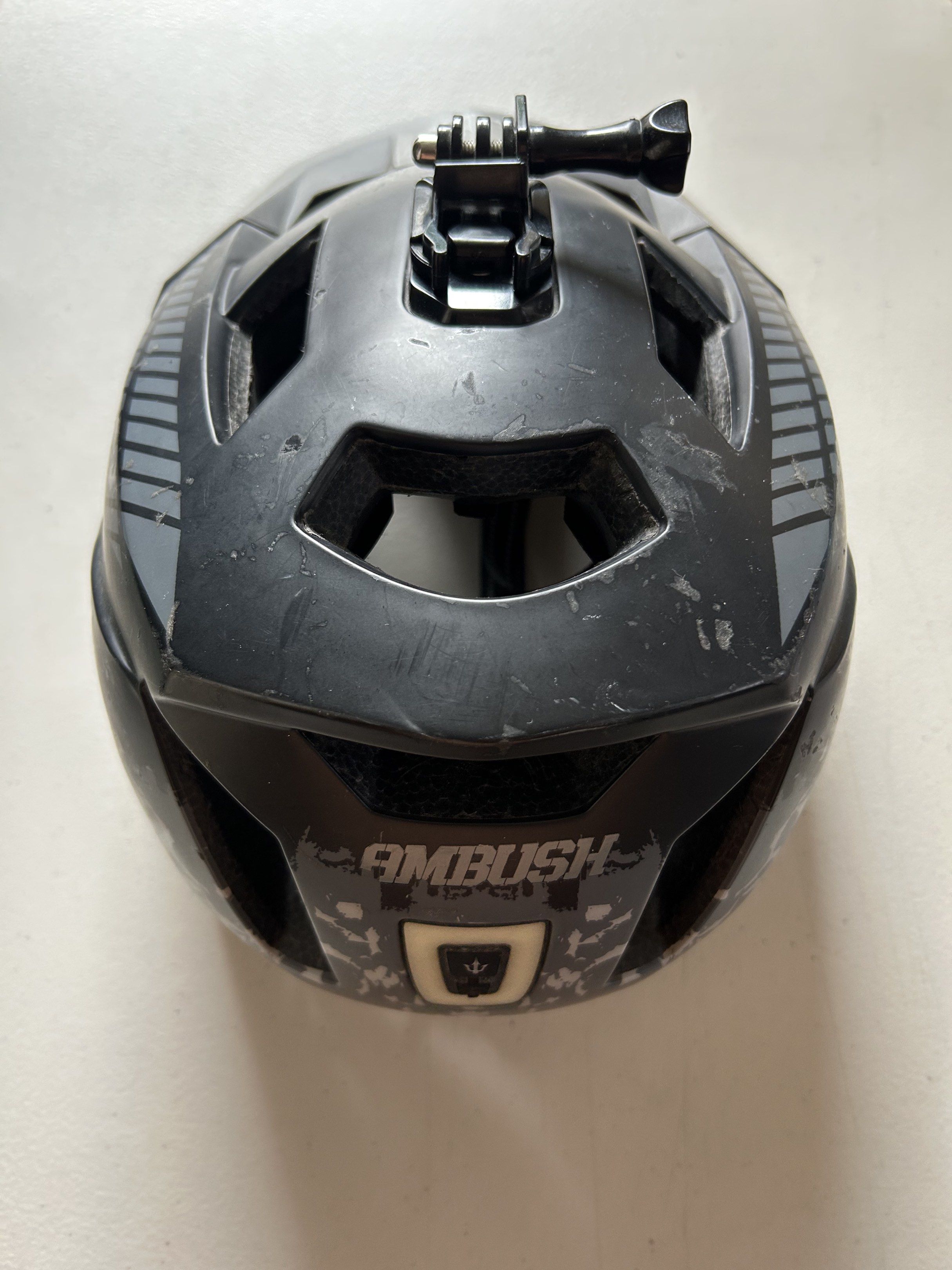 Ambush and PMT Bike Helmets (Category: Bicycles) located in Paranaque City. Submitted by keichi. (Listing ID 1419655250, Image 3). Description: 700 each or 1200 for both Signs of usage All useable Weapon helmet lights no issue with Go Pro mount PMT helmet with Visor Pick-up or Lalamove Parañaque loc - Two black bike helmets available. - Ambush helmet: - Black with camouflage detailing. - Includes GoPro mount. - PMT helmet: Black. - Interiors of b
