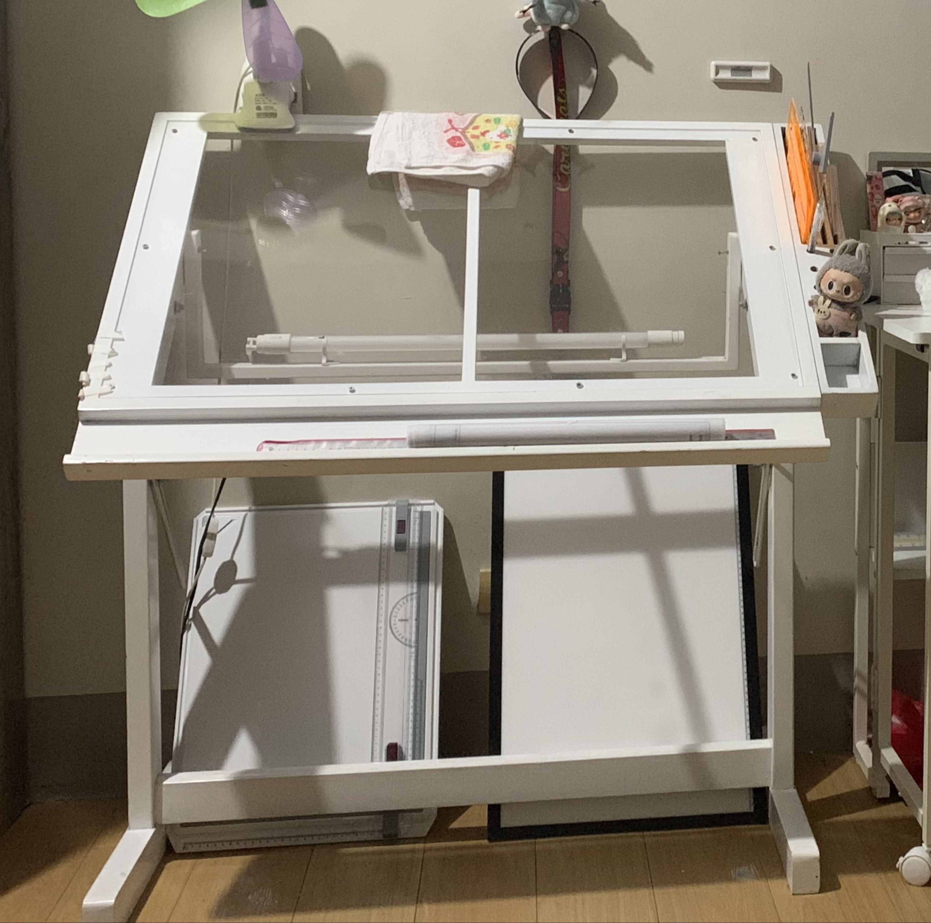 Architecture White Drafting Table with Light (Category: Tables & Sets) located in Pasig City. Submitted by seleneaki (Listing ID 1419696678, Image 1). Description: - White drafting table - Transparent top - Adjustable angle - Built-in tray - With light - Wood - Only the table included.