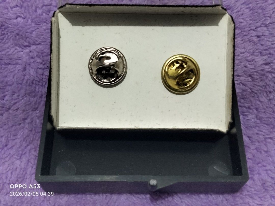 Baseball Pin Set (Category: Vintage Collectibles) located in Carmona. Submitted by rpute (Listing ID 1419772730, Image 3). Description: Pin set features two baseball-themed pins. One pin is gold-colored and shaped like a baseball glove with a baseball inside. The other pin is silver-colored and depicts a baseball player holding a bat. The pins come in a black display case with a clear lid..