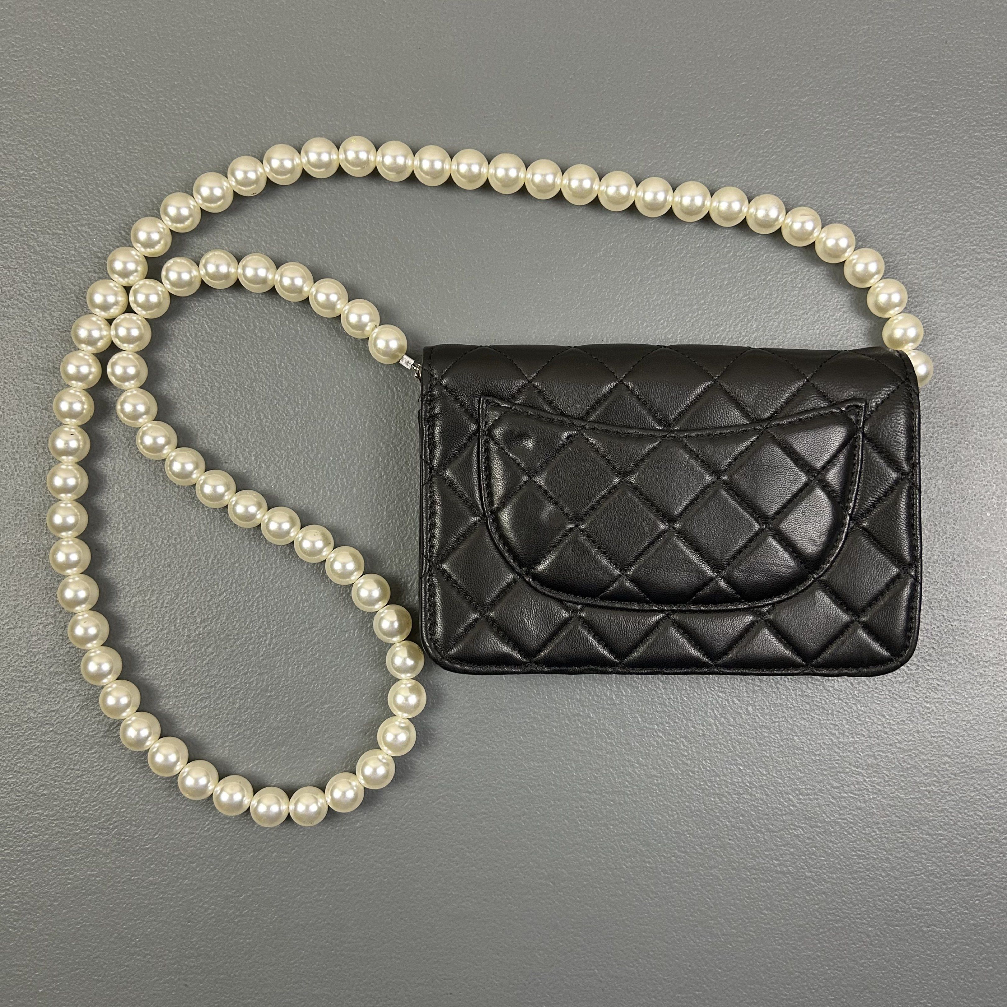 Chanel - Wallet on Chain Maxi Pearls (Category: Cross-body Bags) located in Manila. Submitted by not4every1 (Listing ID 1419737247, Image 2). Description: Chanel - Wallet on Chain Maxi Pearls Condition: Good Flaws: Signs of wear and usage. Broken clasp Measurements: Width: 7.5 Height: 5,25 Depth: 1.25 Strap: 20 1,999 + SF Buy at your own risk. Color may vary due to lighting. Measurements are taken on a flat surface. Manage your expectations..