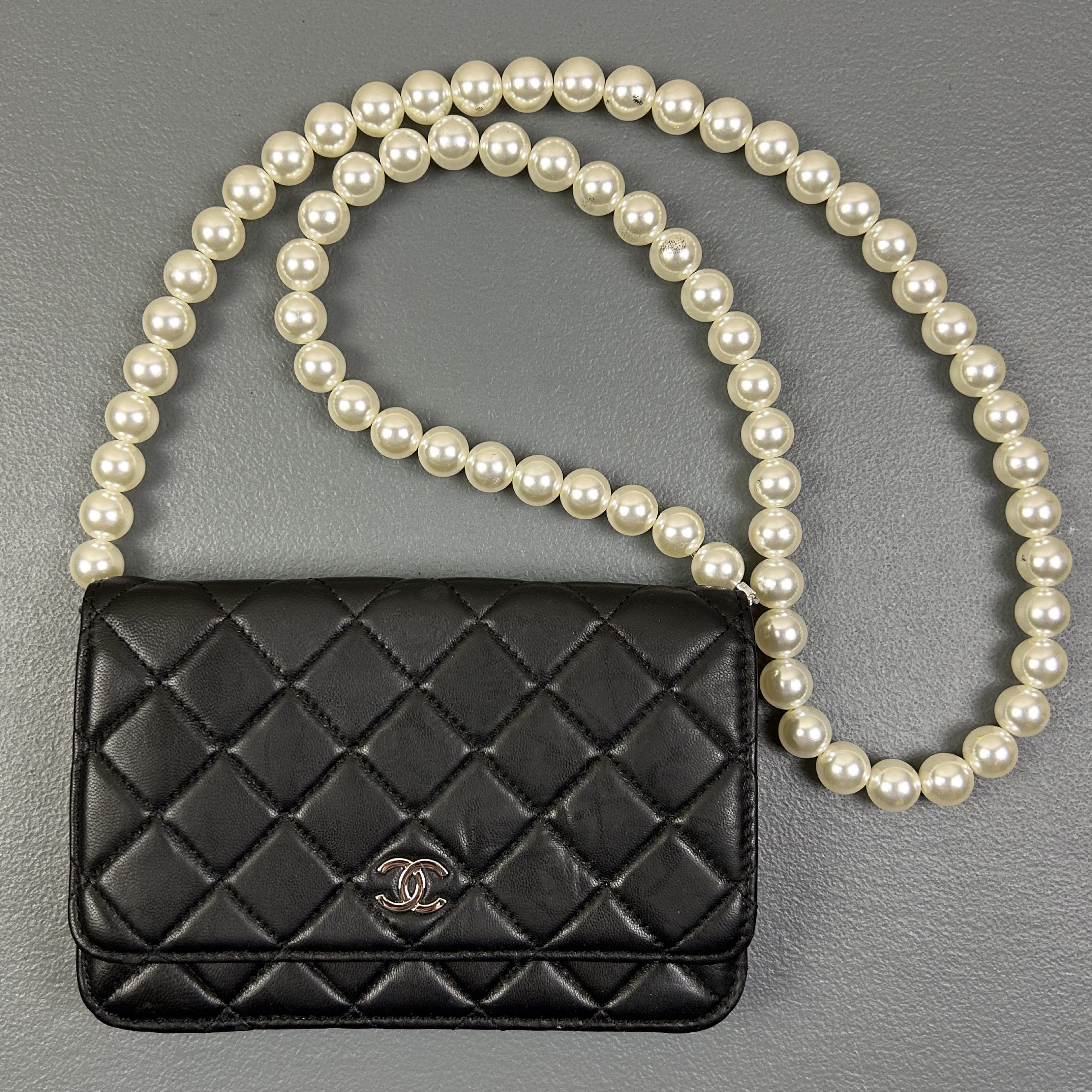 Chanel - Wallet on Chain Maxi Pearls (Category: Cross-body Bags) located in Manila. Submitted by not4every1 (Listing ID 1419737247, Image 1). Description: Chanel - Wallet on Chain Maxi Pearls Condition: Good Flaws: Signs of wear and usage. Broken clasp Measurements: Width: 7.5 Height: 5,25 Depth: 1.25 Strap: 20 1,999 + SF Buy at your own risk. Color may vary due to lighting. Measurements are taken on a flat surface. Manage your expectations..