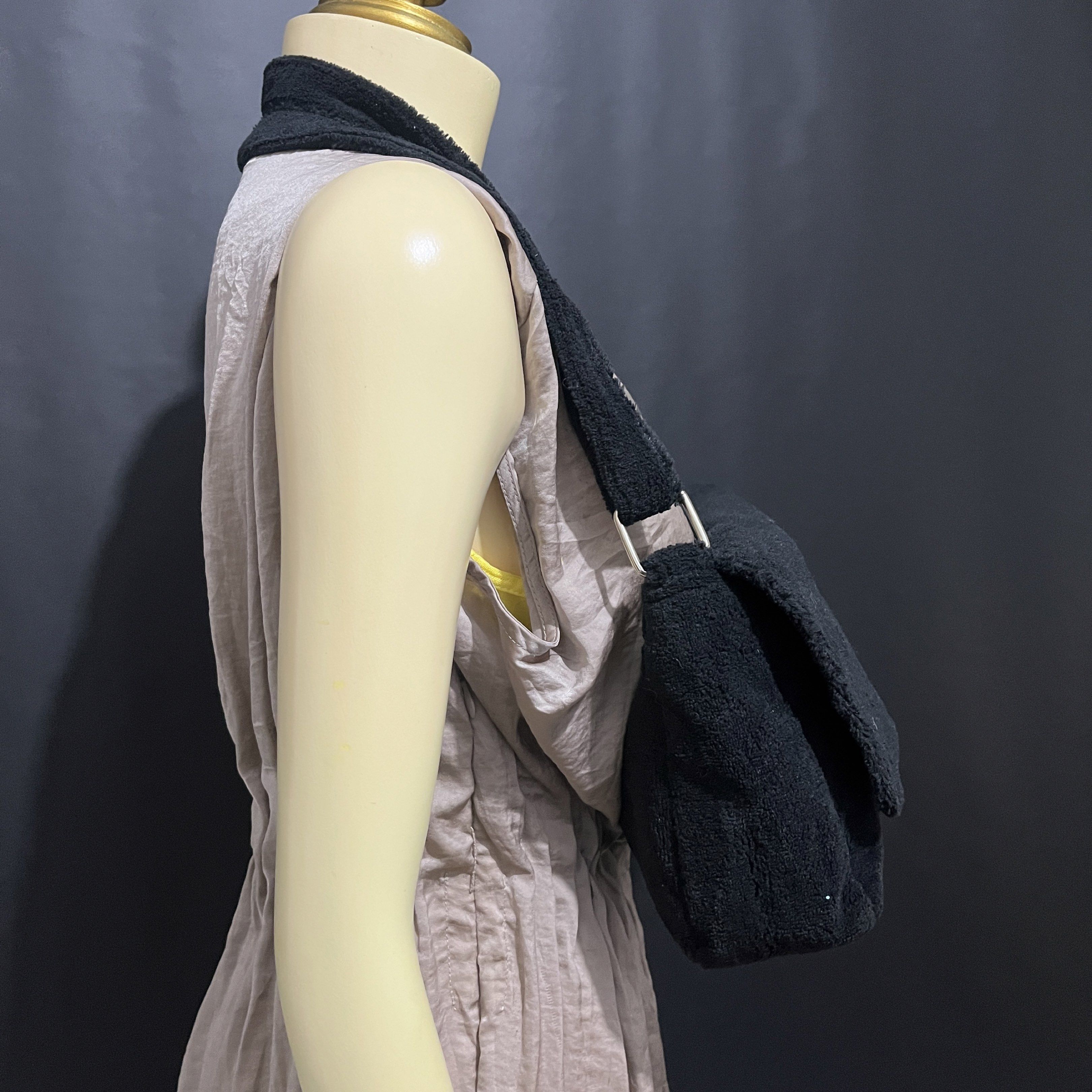 Chanel Black Sling Shoulder Bag (Category: Luxury Bags & Wallets) located in Cabadbaran. Submitted by dfgthriftology (Listing ID 1419712119, Image 2). Description: - Black shoulder bag - White Chanel logo - Flap closure - Shoulder strap - Interior zippered pocket - Snap closure - Soft, plush texture - Includes Chanel Precision tag.