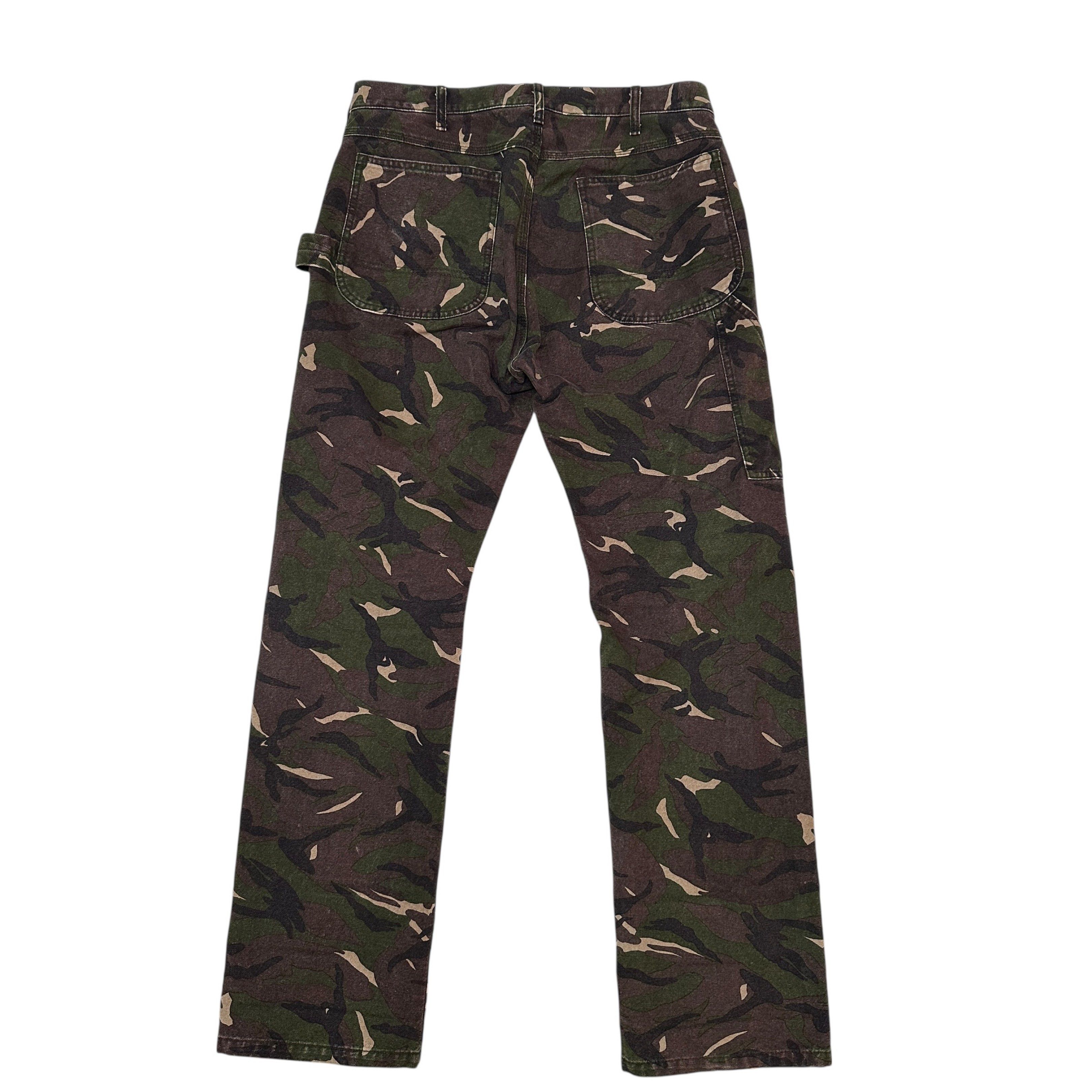COMME DES GARCONS HOMME | Camo Carpenter Pants (Category: Jeans) located in Lapu Lapu. Submitted by nervecloset (Listing ID 1419668772, Image 1). Description: COMME DES GARCONS HOMME | Camo Carpenter Pants Medium on tag Fits 34 Actual measurements shown in photos Very Good condition Issue : small hole in right thigh area (please see last photo) 2850 + sf.