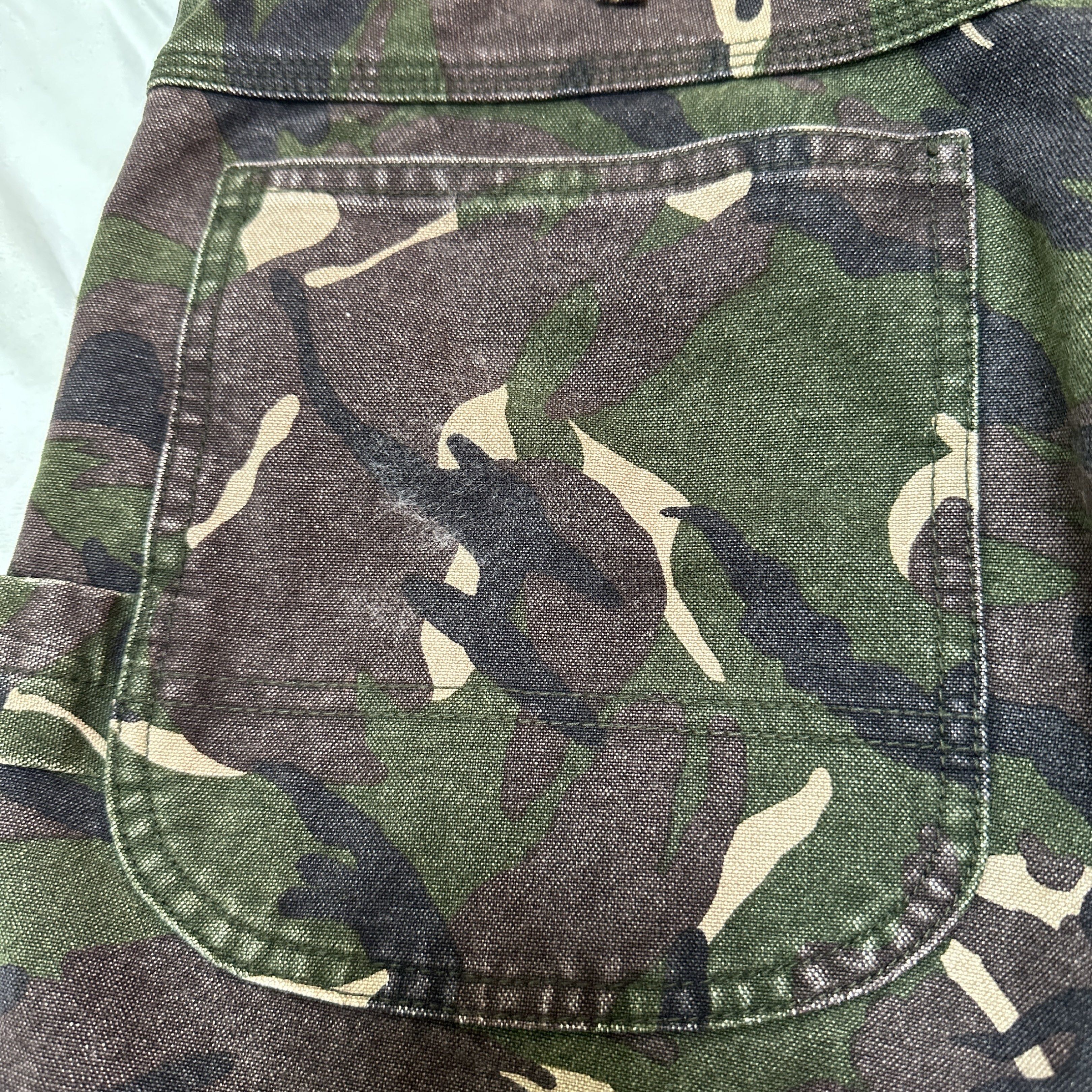 COMME DES GARCONS HOMME | Camo Carpenter Pants (Category: Jeans) located in Lapu Lapu. Submitted by nervecloset (Listing ID 1419668772, Image 3). Description: COMME DES GARCONS HOMME | Camo Carpenter Pants Medium on tag Fits 34 Actual measurements shown in photos Very Good condition Issue : small hole in right thigh area (please see last photo) 2850 + sf.