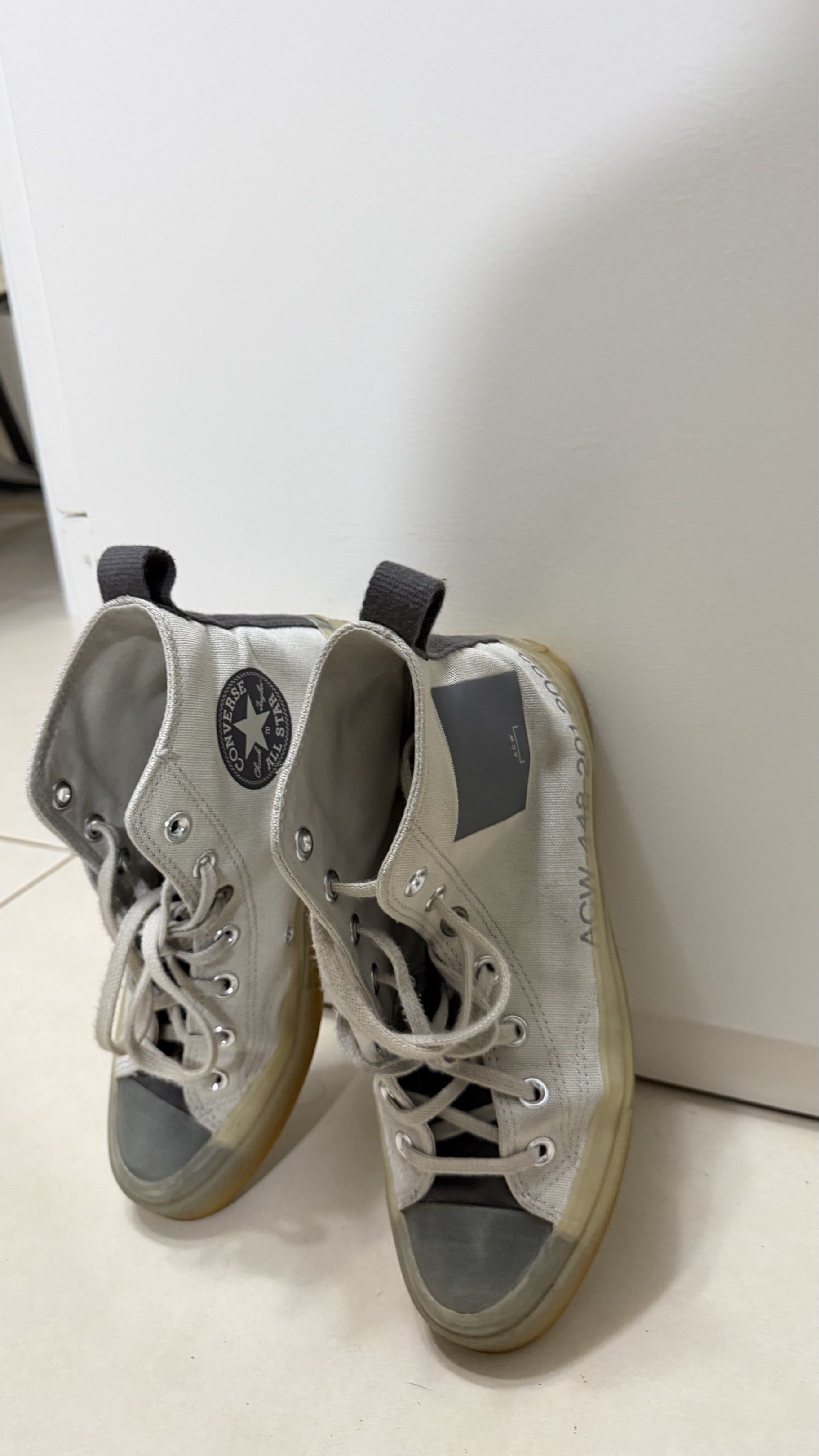 Converse Chuck Taylor ACW High Top Sneakers (Category: Sneakers) located in Quezon City. Submitted by elsa_592 (Listing ID 1419691430, Image 2). Description: - LIMITED EDITION COLLABORATION EITH A COLD WALL Converse Chuck Taylor high-top sneakers - White canvas upper - Grey accents on toe cap and heel - Translucent sole - ACW branding - Size: US 8 Men's / US 10 WMNS Authentic. No more box. Rfs: Decluttering to many shoes .