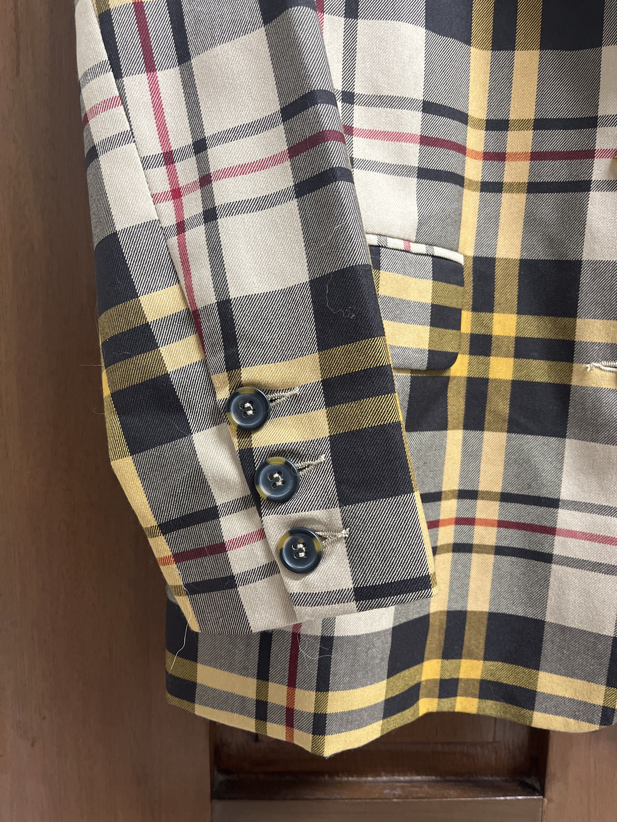 Cotton On Plaid Blazer (Category: Coats, Jackets and Outerwear) located in Muntinlupa City. Submitted by timttam (Listing ID 1419716587, Image 2). Description: - Cotton On plaid blazer - Classic black, yellow, and beige plaid pattern - Features: two-button closure, front pockets, sleeve buttons - Fully lined in black fabric - Perfect for adding a touch of sophistication.