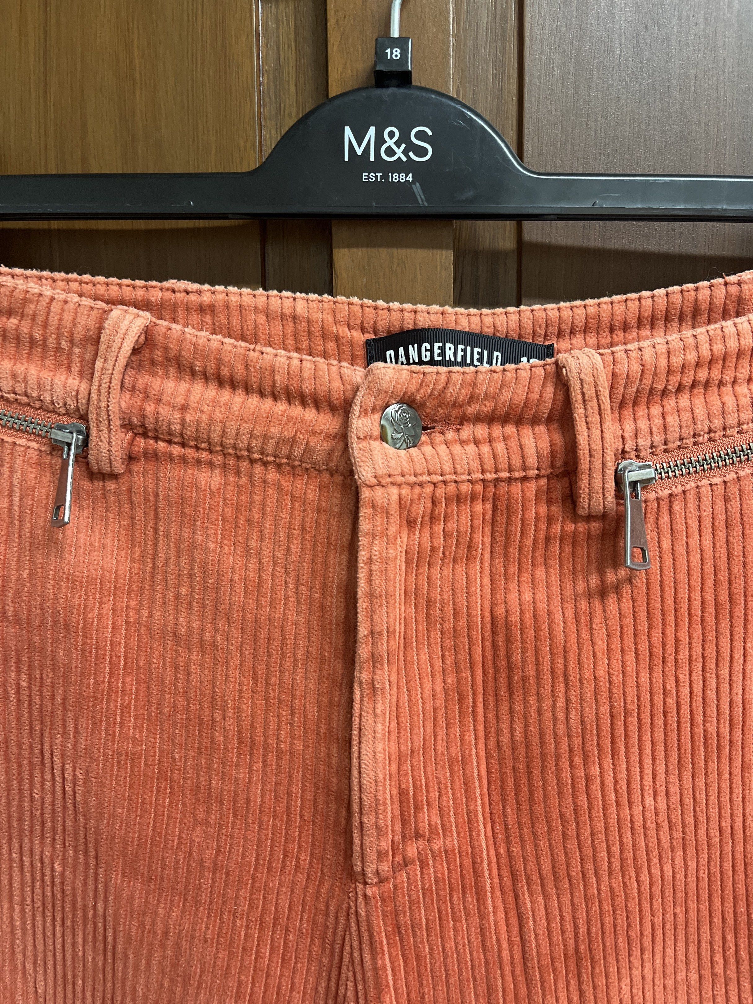 Dangerfield Corduroy Culottes (Category: Other Bottoms) located in Muntinlupa City. Submitted by timttam (Listing ID 1419720200, Image 2). Description: - Dangerfield corduroy culottes - Vibrant orange color - Wide-leg design - Button and zipper closure - Features front and back pockets - Comfortable and flattering fit - Perfect for a stylish look.