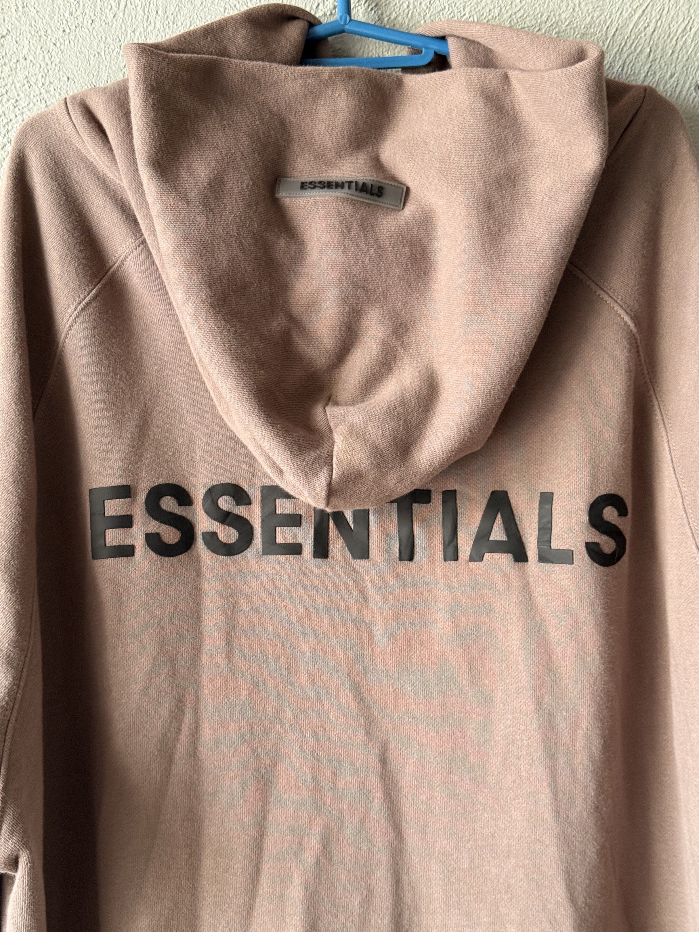Essentials Fear of God Hoodie (Category: Hoodies) located in Marikina City. Submitted by luis_morcello (Listing ID 1419608465, Image 1). Description: - Fear of God Essentials Hoodie - Size: Medium - Features: Full zip closure, hood - Design: "ESSENTIALS" back print, Essentials logo on hood and sleeve - Material: 100% Cotton.