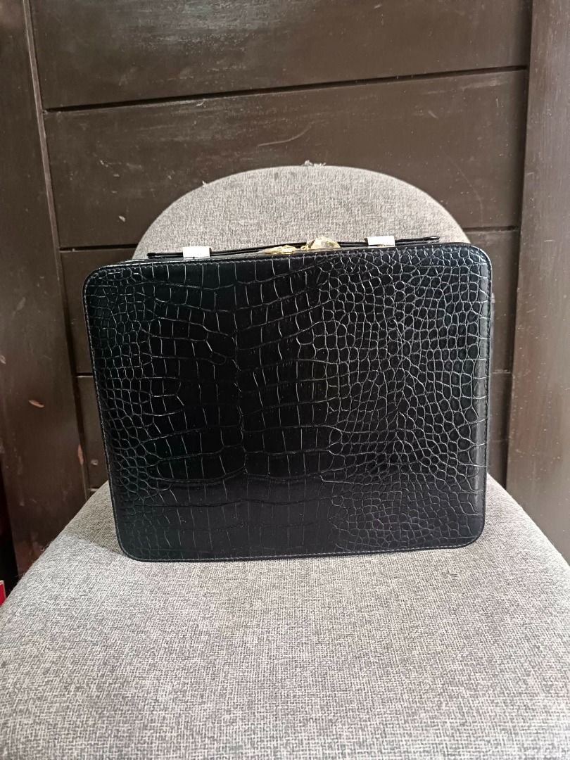 ESTEE LAUDER Vintage Black Crocodile-Embossed Hard Zip Makeup Case (Category: Makeup) located in Santa Rosa. Submitted by dco.sells (Listing ID 1419668077, Image 3). Description: Description: - Vintage Estée Lauder hard-case cosmetic train case in black faux-croc. Originally part of an late 2000s holiday set. Great for makeup, skincare, or travel. Brand new, unused, and comes with the original Estée Lauder holiday box. Features: - Elegant black c