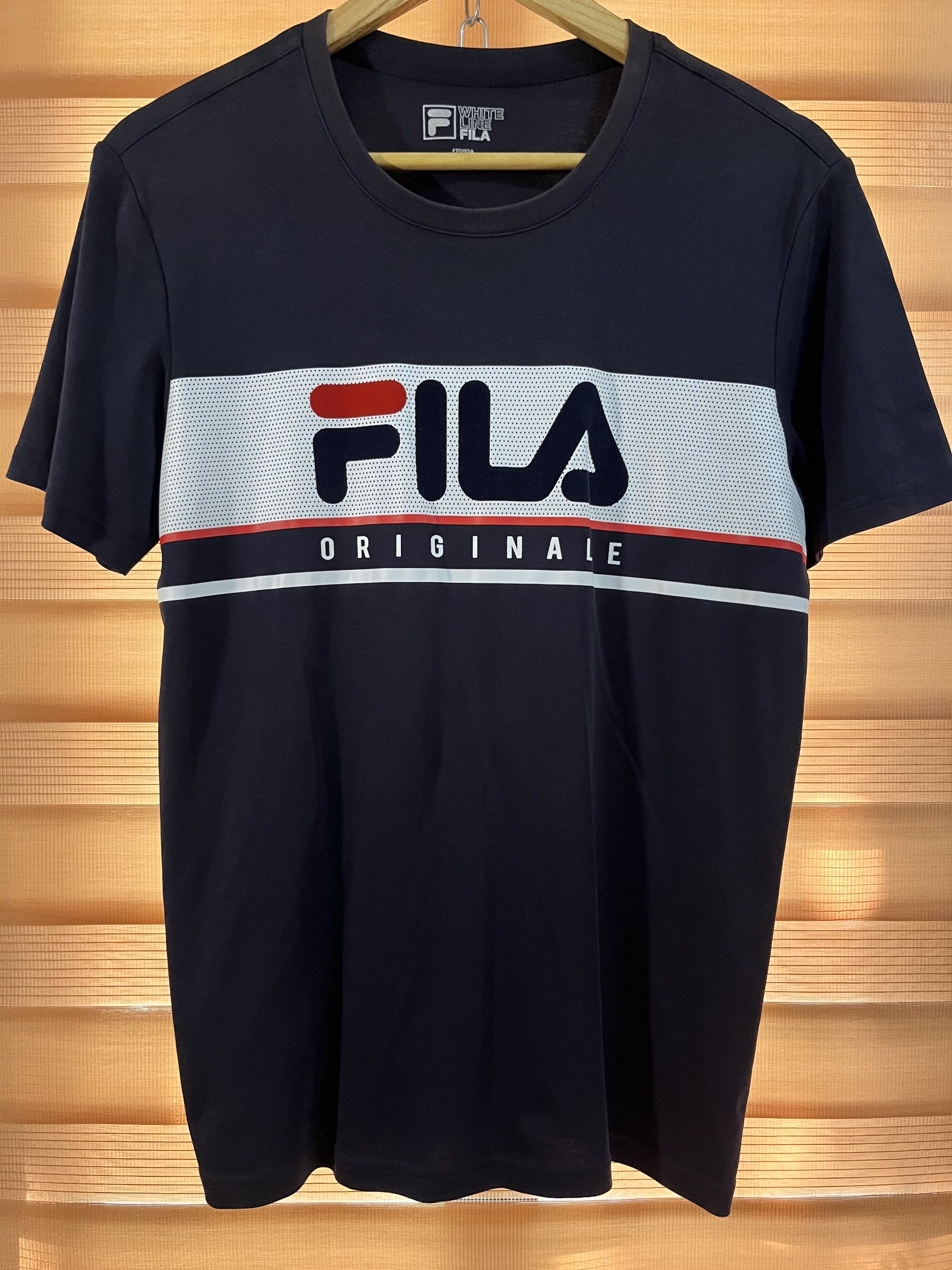 Fila White Line Originale T-shirt (Category: Tshirts & Polo Shirts ) located in Paranaque City. Submitted by mondaysglory (Listing ID 1419680354, Image 1). Description: Fila Laurentin regular fit T-shirt in navy blue, made of 65% polyester and 35% cotton L - 27 W - 18 Color rate: 9.5/10 Condition: Good - Navy blue Fila t-shirt - White stripe across chest - Red and navy Fila logo - Crew neck, short sleeves - Size: M (170/92A).