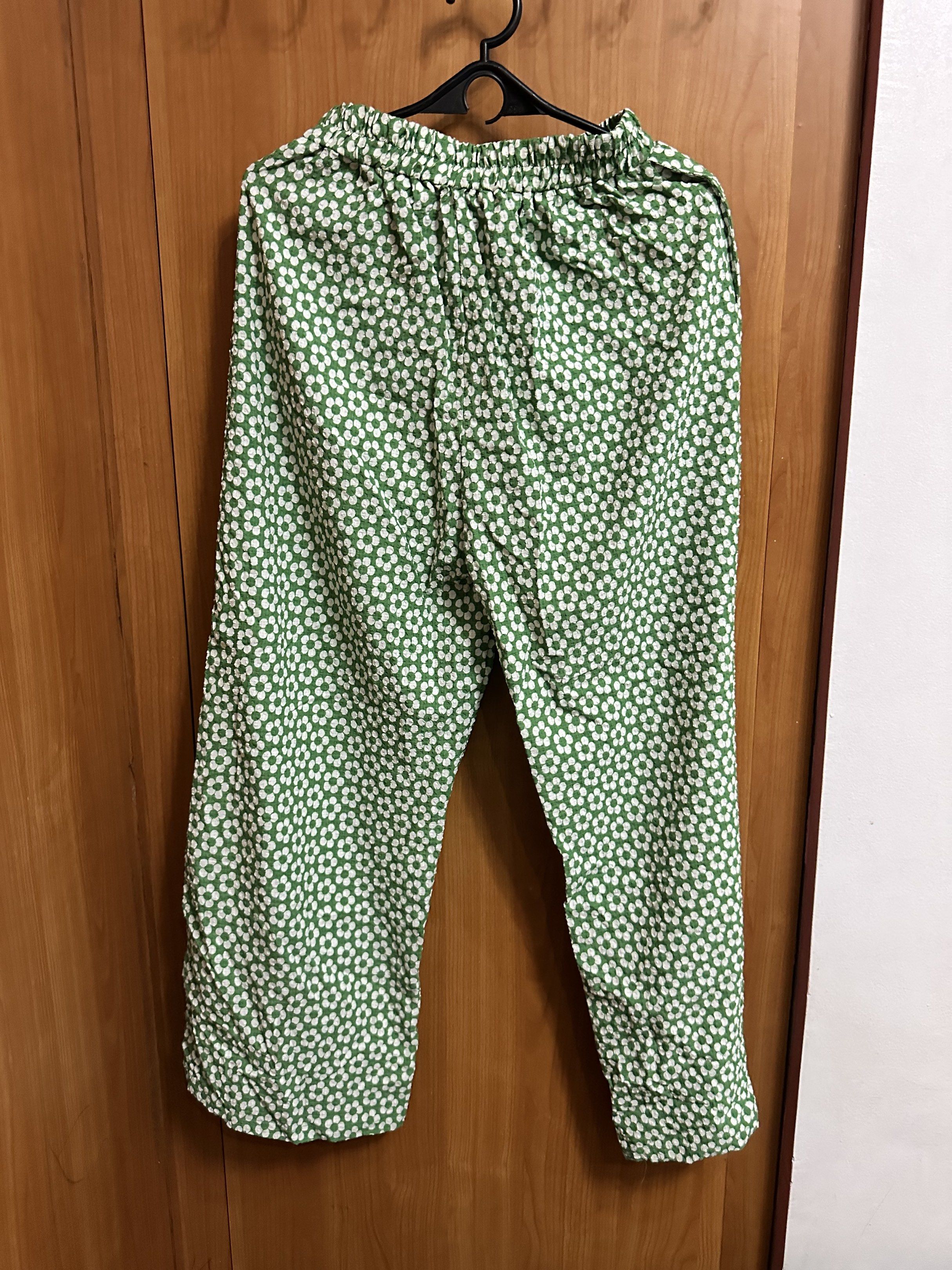 Floral Embroidered Top and Pants Set (Category: Sets or Coordinates) located in Manila. Submitted by _lovedbyurstrully (Listing ID 1419633815, Image 2). Description: - White, short-sleeved top with floral embroidery and green trim - Features a tie-up front - Includes green pants with a white floral pattern - Pants have an elastic waistband - Perfect for a casual, comfortable look.