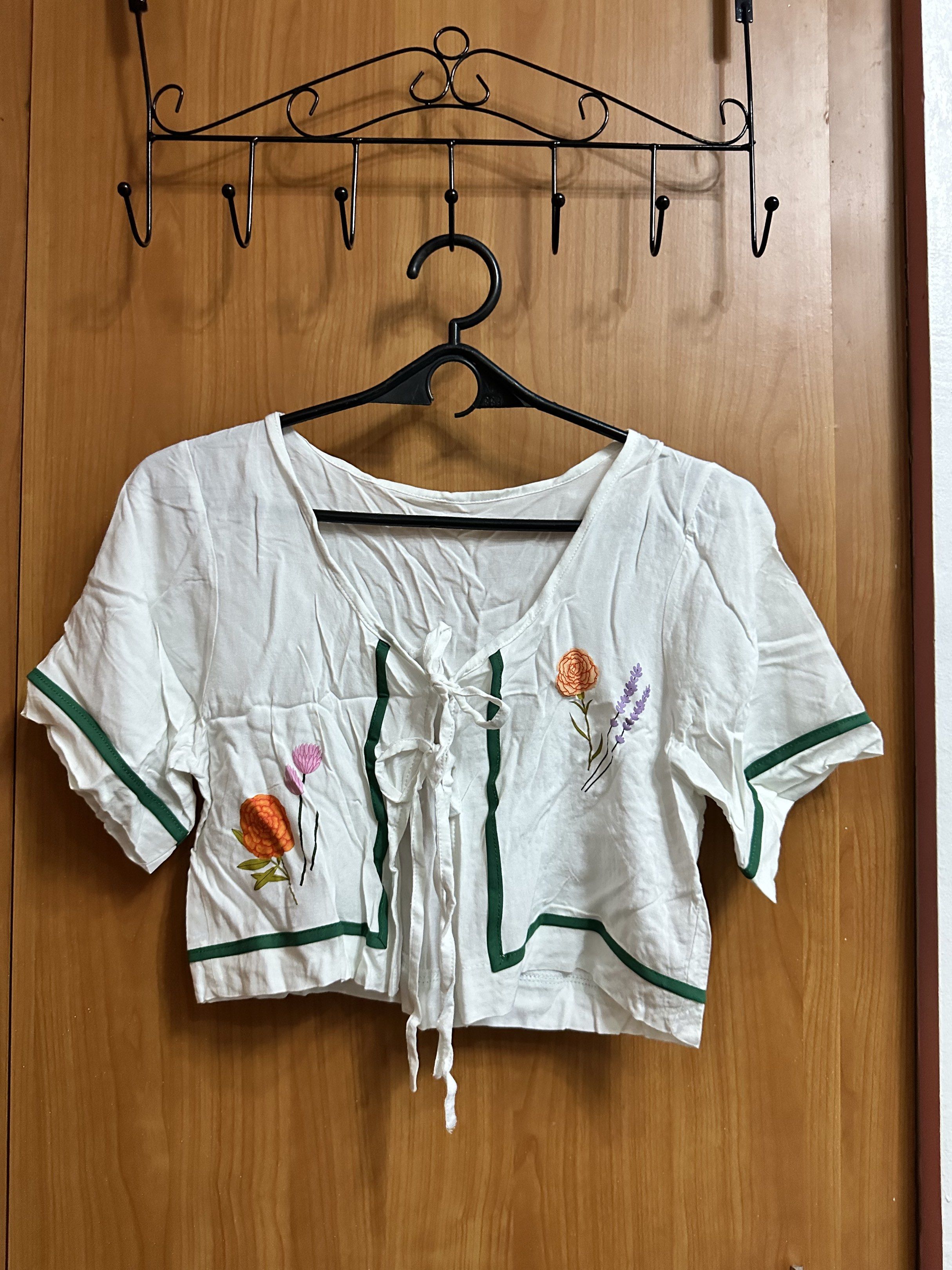 Floral Embroidered Top and Pants Set (Category: Sets or Coordinates) located in Manila. Submitted by _lovedbyurstrully (Listing ID 1419633815, Image 1). Description: - White, short-sleeved top with floral embroidery and green trim - Features a tie-up front - Includes green pants with a white floral pattern - Pants have an elastic waistband - Perfect for a casual, comfortable look.