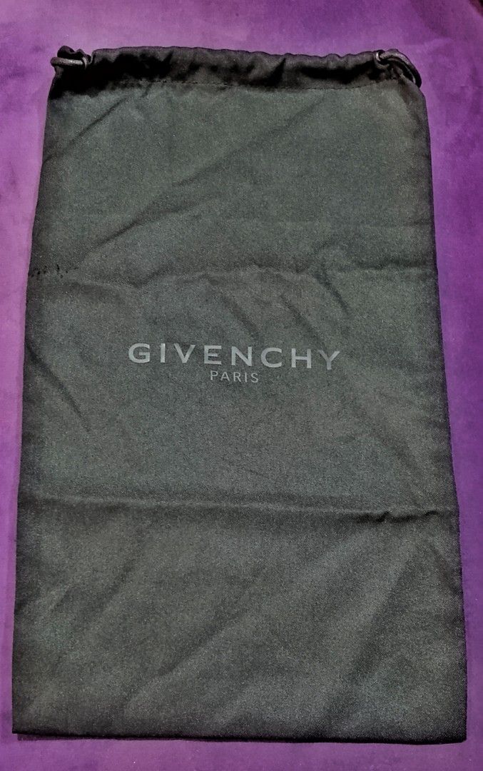 Givenchy Dust Bag (Category: Luxury Bags & Wallets) located in Cabanatuan. Submitted by miss.maia (Listing ID 1419762966, Image 1). Description: - Authentic Givenchy dust bag - Features the Givenchy Paris logo - Color: Black - Closure: Drawstring - Dimensions: Approximately 15 inches (length) x 8 inches (width) - Perfect for protecting luxury items - Comes in plastic packaging.