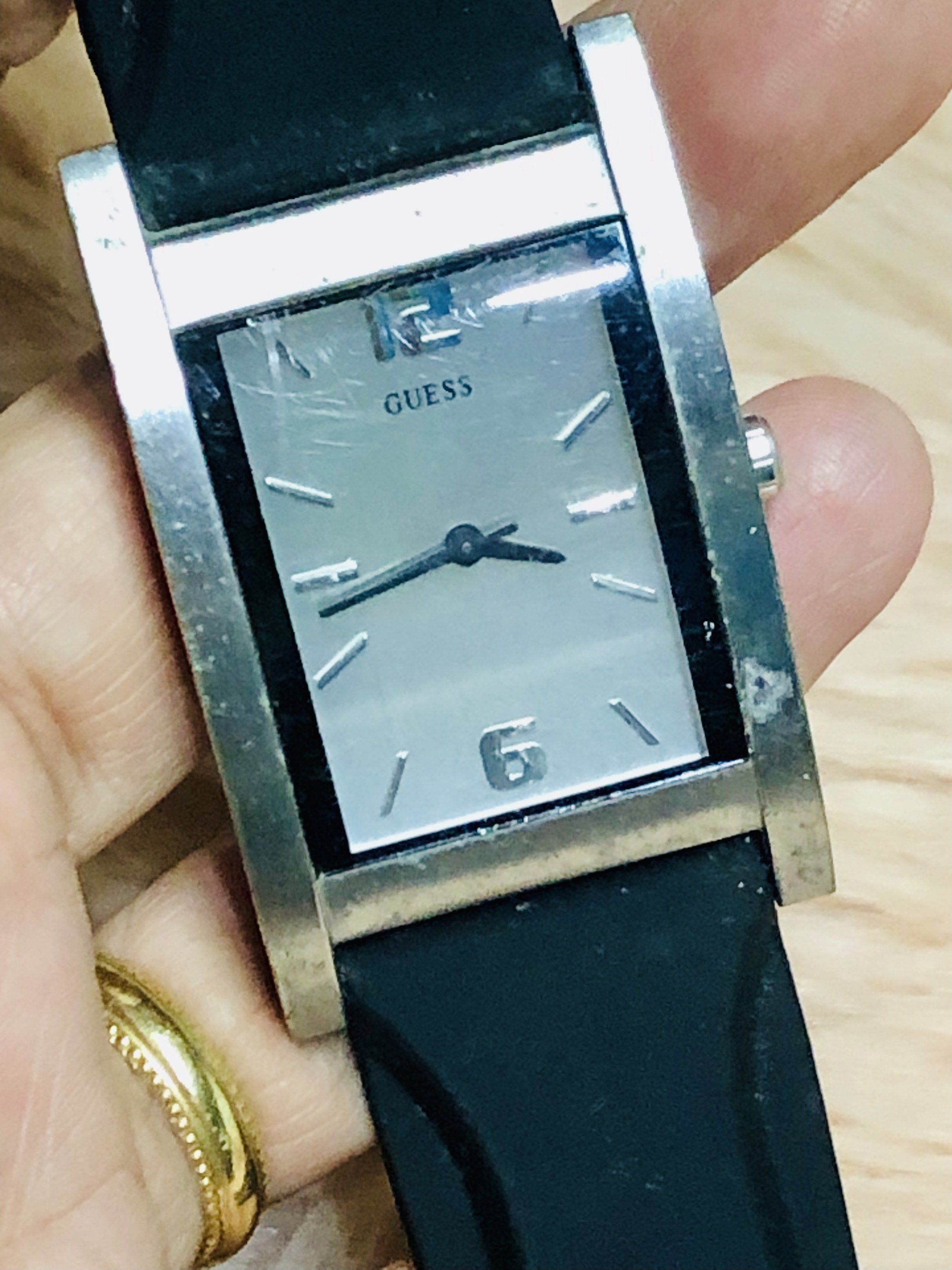 Guess Rectangular Watch (Category: Luxury Watches) located in Cavite. Submitted by onstuffs_19 (Listing ID 1419740439, Image 2). Description: - Guess watch with a rectangular silver-tone case - Black strap - Silver dial with Guess logo - Visible 12 and 6 numerals - Includes an additional black leather strap.