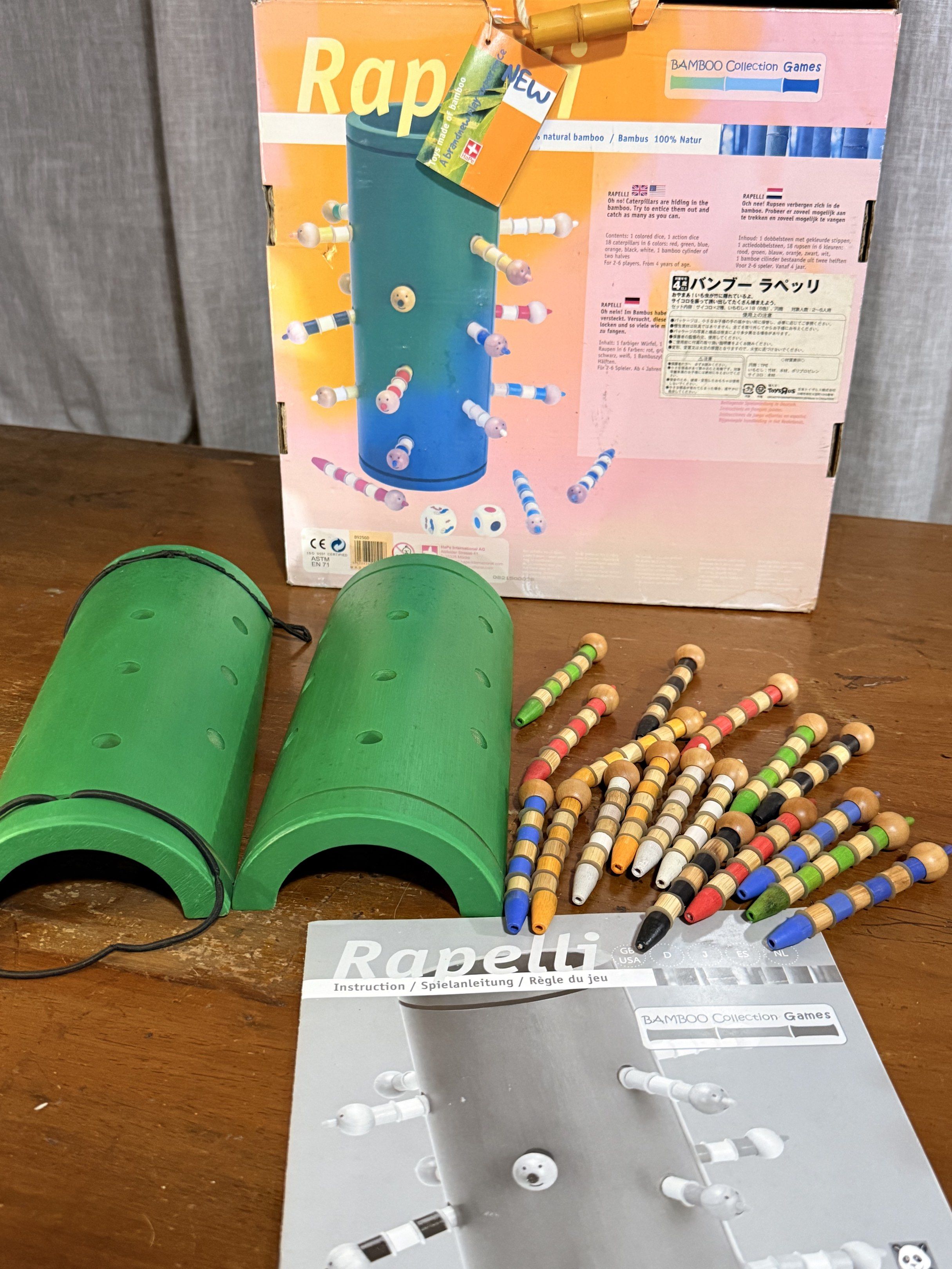 Hape Rapelli Bamboo Collection Game (Category: Educational & Learning Toys) located in Valenzuela. Submitted by missp22 (Listing ID 1419757510, Image 2). Description: - Rapelli game from Hape's Bamboo Collection - Features a cylindrical bamboo structure - Includes two green bamboo pieces - Comes with multiple colorful wooden pieces - Includes the instruction manual - Box is included - Recommended for ages 4-99 - what u see is what u get.