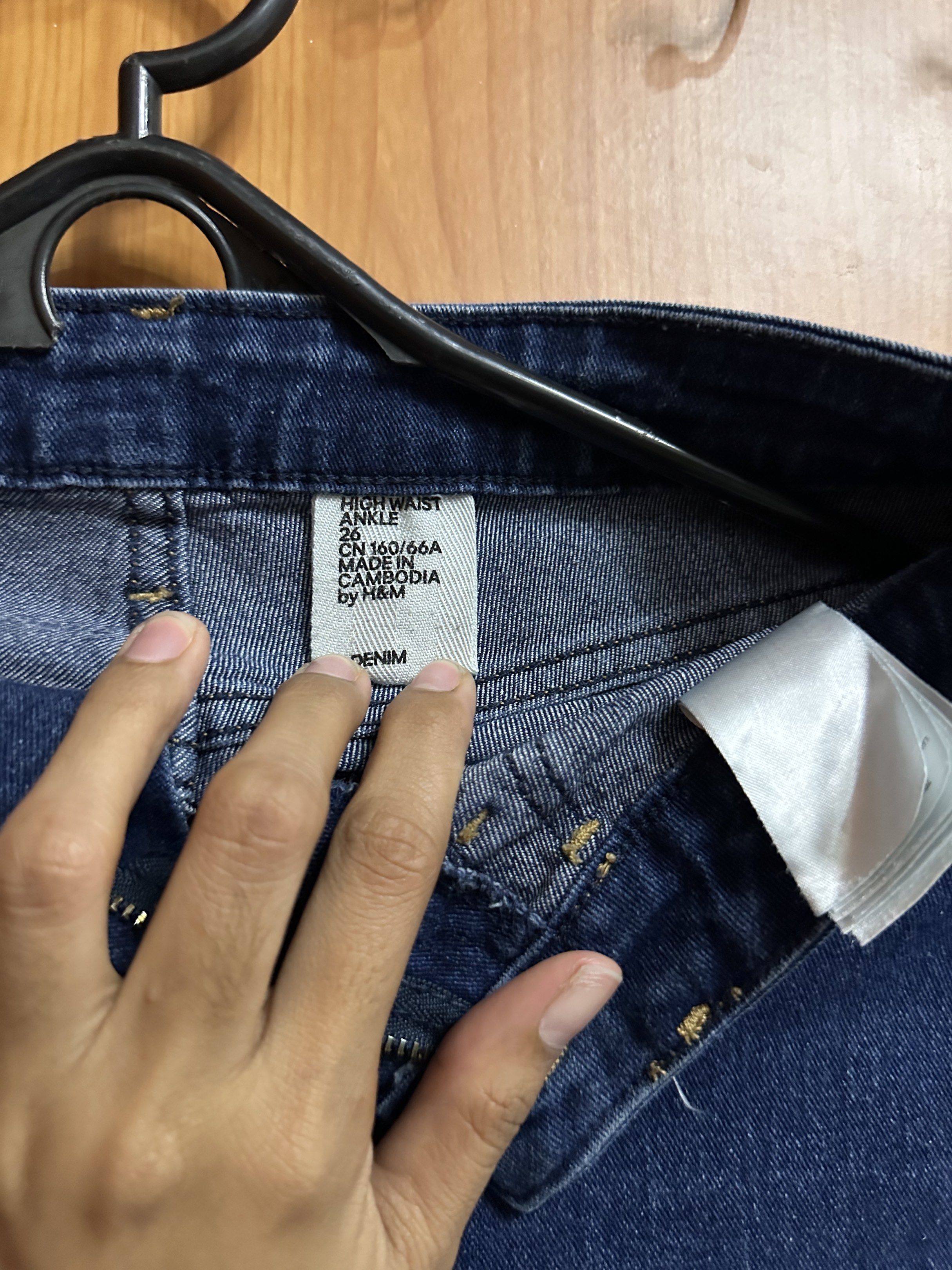 H&M High Waist Ankle Jeans (Category: Jeans) located in Manila. Submitted by _lovedbyurstrully (Listing ID 1419628033, Image 2). Description: - H&M dark blue high-waisted ankle jeans - Classic five-pocket design - Zip fly with button closure - Size: CN 160/66A - Made in Cambodia.